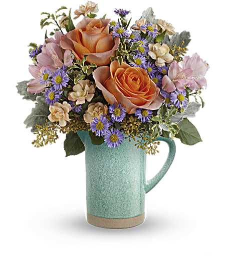 Teleflora's Aqua Amour Bouquet - It's easy to fall in 'amour' with this enchanting garden rose arrangement and its food-safe, stoneware pitcher with amazing aqua glaze.