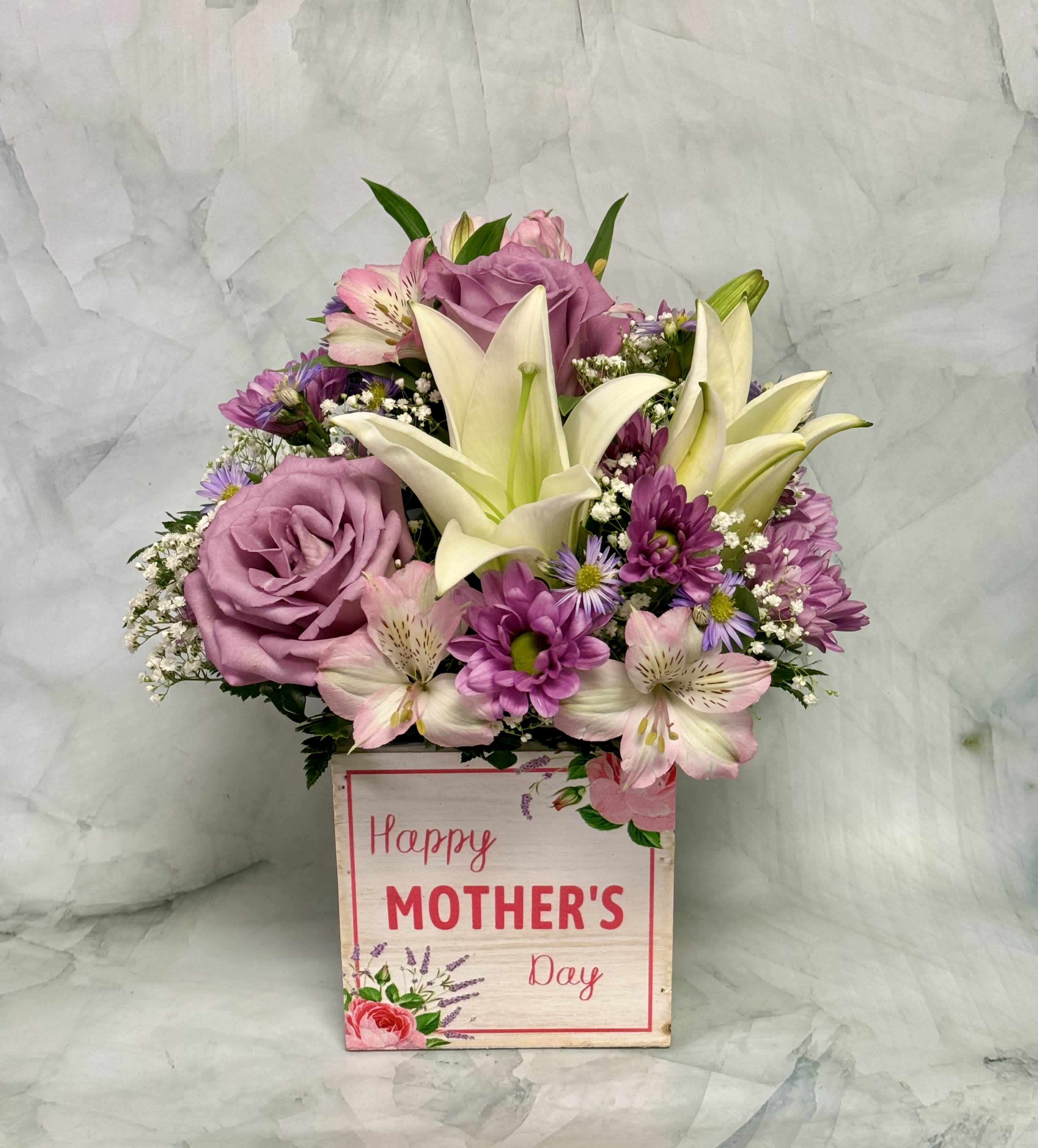 Happy Mother’s Day Flower Box - This Mother’s Day mom will remember! Send her this gorgeous flower box that is filled with all of mom’s favorites. It includes Lilies, Roses, Chrysanthemums, Liatris and more. 