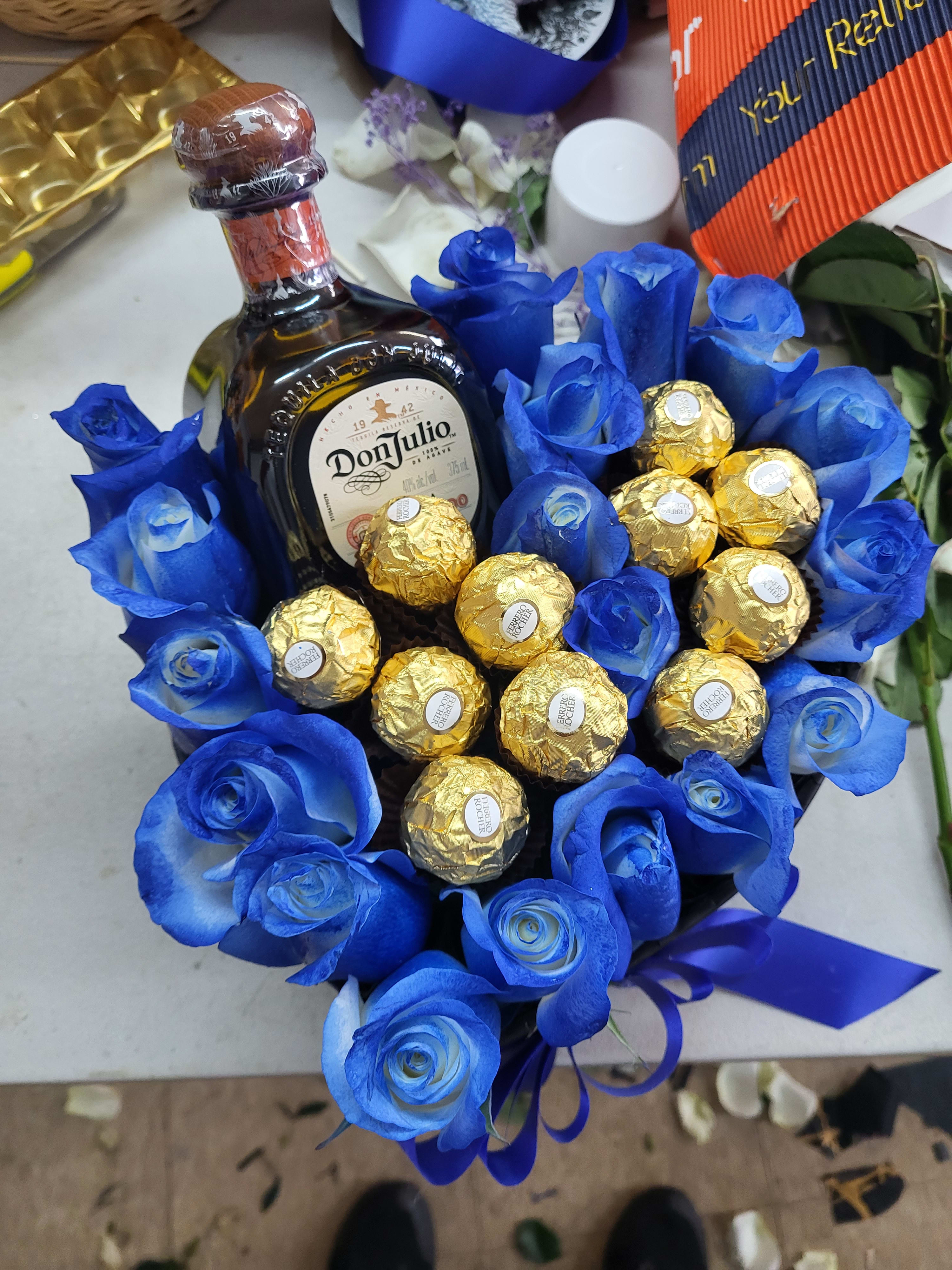 Blue Rosas and 1 tequila  - They are blue rosas and a bottle of tequila was an idea for Father's day 