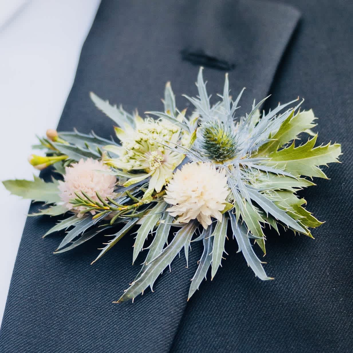 Boutonniere - Petite floral accents for the gentlemen. Easy-pin attachment included.  