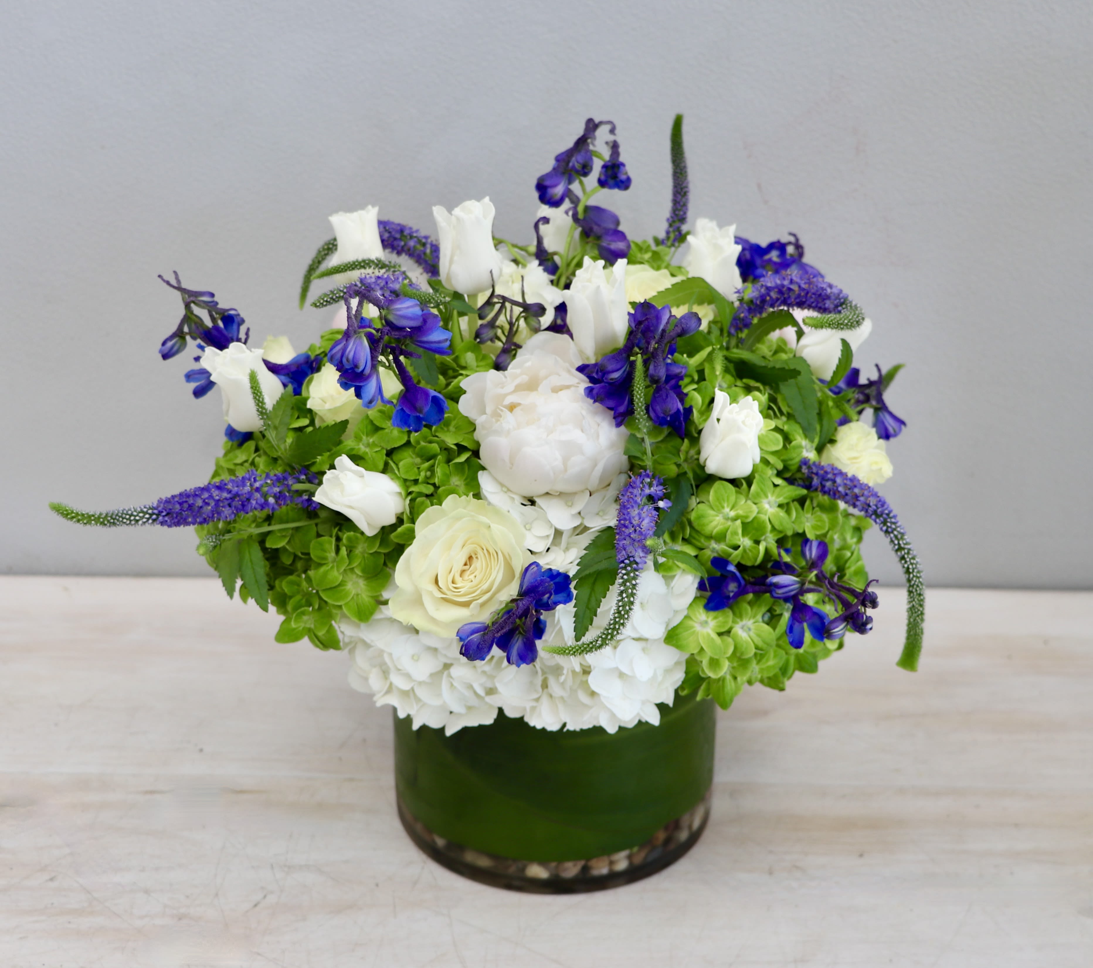 Seasonal Hydrangeas and Company - Glendale Florist - This arrangement features seasonal hydrangeas along with white and blue flowers.  