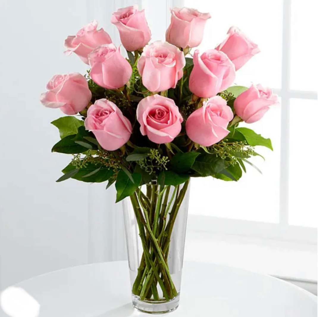 Pink Roses Arrangement - Pink roses in a clear vase with beautiful greenery. Choose between 12, 24 or 36 roses