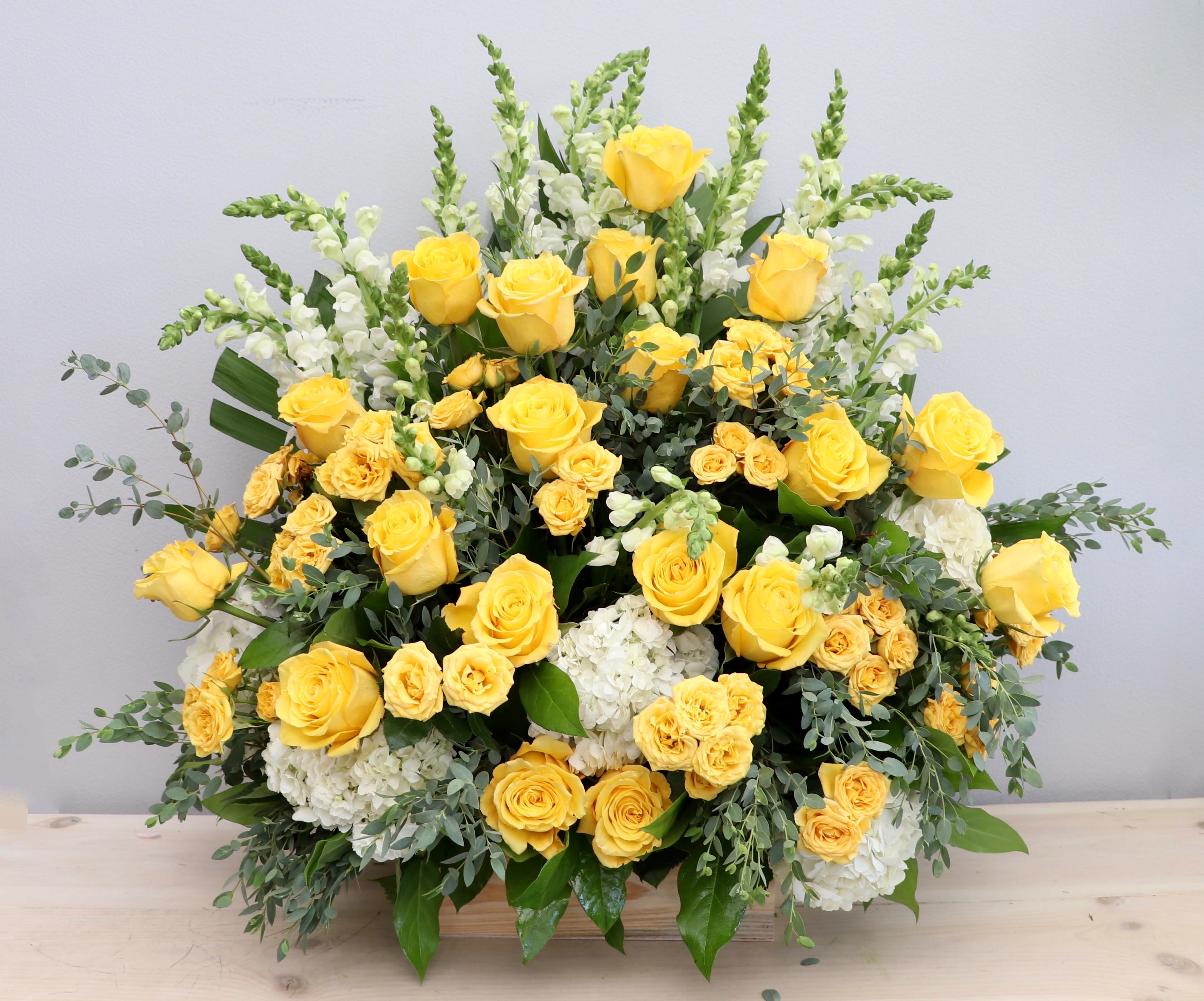 Yellow Skies Basket Spray - My Glendale Florist - This yellow basket arrangement is sure to brighten up any room, for any occasion. The design stands at about 30&quot; tall and 30&quot; wide.