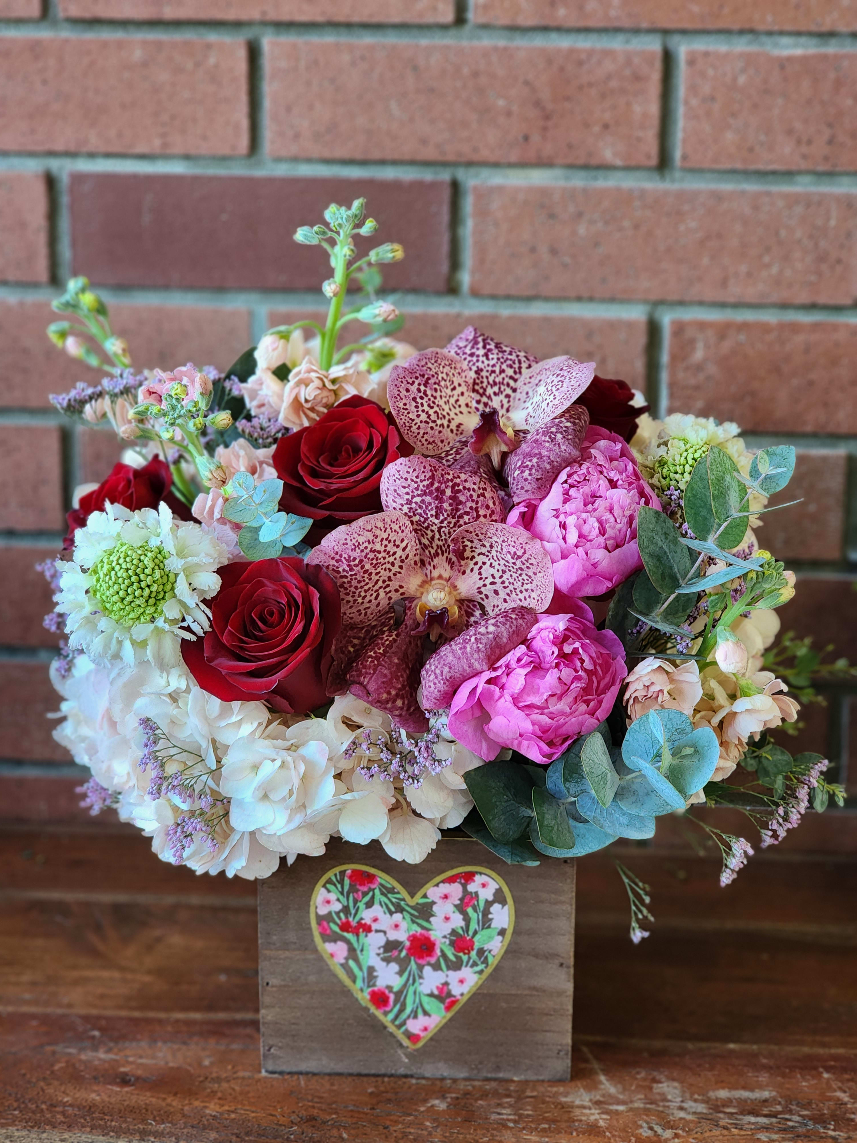 Blooming Love Bouquet Blooming Love Bouquet - If your Love blooms and blossoms, this bouquet is the perfect choice! Dreamy orchids, hydrangeas, roses, spray roses, peonies stock all premium high quality blooms for your special love to enjoy!