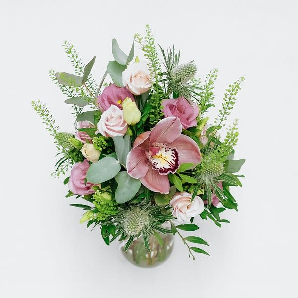 Strawberry Delight - The cutest pink-themed bouquet crammed with red cymbidium, pink lisianthus, Thistle, and fragrant eucalyptus. 