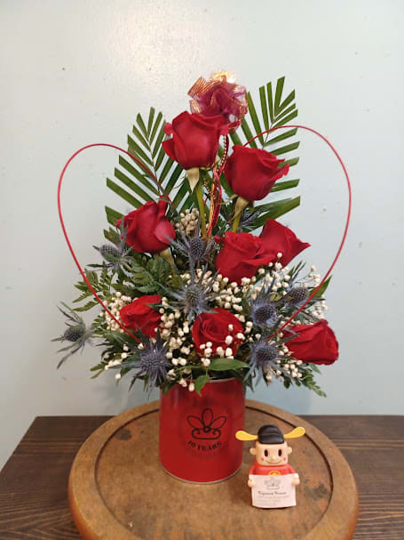 &quot;Cindy's Choice&quot; Bouquet - Discover the passion of 'Cindy's Choice' Bouquet. Bold red roses entwine with the unique charm of eryngium, creating a striking dance of elegance. Presented in a vibrant red tin bucket, this arrangement is not just a choice; it's a statement of love and sophistication. Let passion blossom.