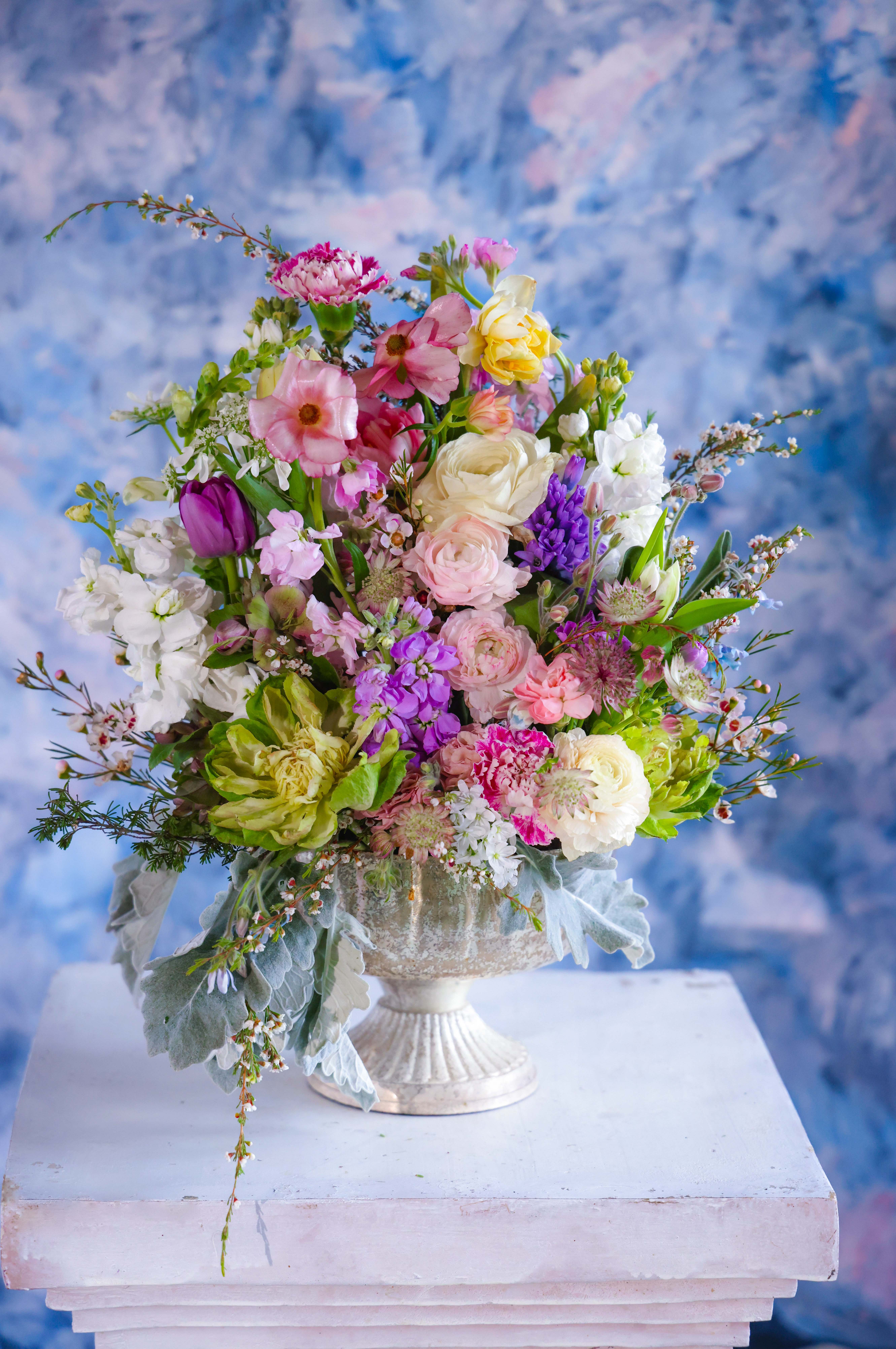 The Vacay at Versailles Arrangement - For those who dream lavishly. Walk amongst the royal, formal gardens with a silk embroidered parisol in hand. An arrangement to feel of noblesse. One of a kind by floral designer Stacy Leafsong Arrangements will be delivered by 7pm, for a specific delivery time please include in special instructions. On holidays, our busiest times, deliveries will be made by 7:30pm.
