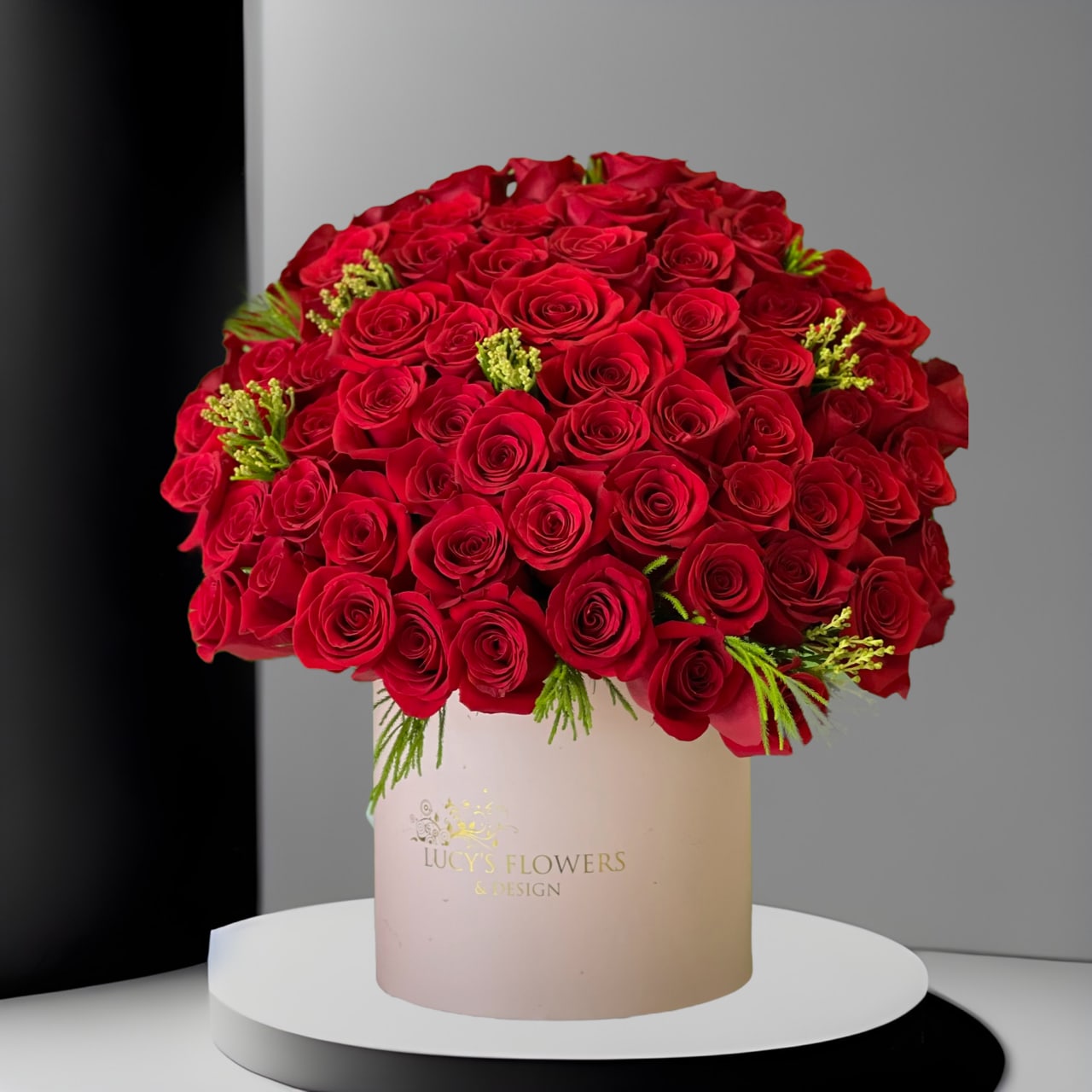 Lucy's Signature Red Rose Box - Although you already know that giving flowers is going to brighten their day, our most popular and iconic arrangement will definitely make the recipient feel extra special and loved!  The perfect way to show, you love someone on Valentine's Day!  Arrangement Includes:  - 50 Fresh cut red roses - Lucy's Signature medium size box  
