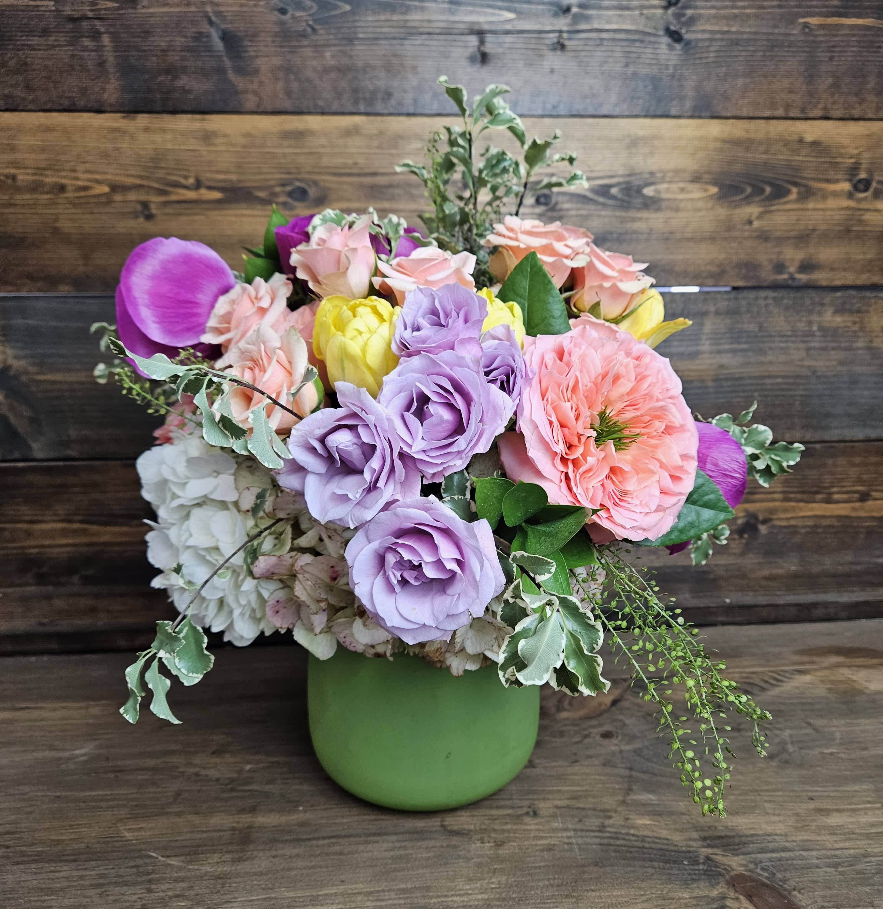 Spring Fling - Hydrangea, Anemones, Tulips, and Roses arranged to make a beautiful spring bouquet.