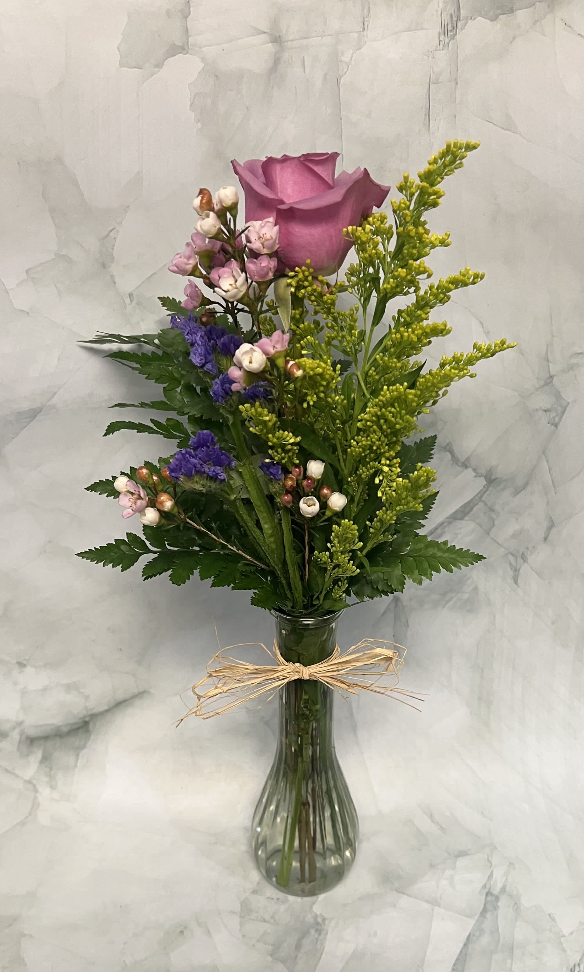 Buds of Beauty - This beautiful arrangement is so simple yet full of beauty. This includes a single Rose, Aster, Wax, and a sprig of Statice. 