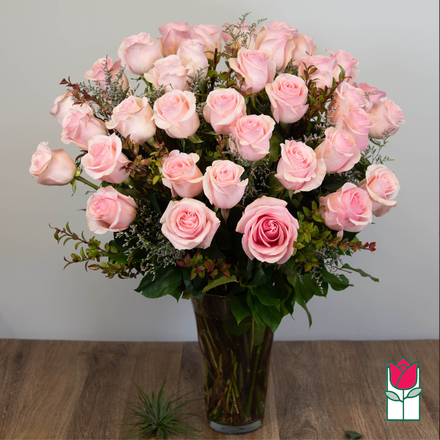 Beretania's 3 Doz. Extra Long Stem Pink Rose Bouquet (Pink Hue May Vary) - 3 Dozen Premium Extra Long Stem Pink Roses  Indulge in the timeless elegance of the Beretania Florist Premium Extra Long Stem Roses bouquet. Our exquisite bouquet features premium Ecuadorian extra-fancy roses, which are 30% larger than any other rose in the islands. Available in a classic glass vase with assorted foliage and filler flowers, this bouquet is the perfect gift for any occasion.  But our exceptional product is only half the story. At Beretania Florist, we pride ourselves on our professional and convenient delivery service. We carefully hand-deliver each bouquet to ensure it arrives at its destination in pristine condition. Our team is dedicated to providing the highest level of customer service, and we strive to exceed your expectations with every order.  And for added convenience, we offer the option to choose or upgrade the number of roses in your bouquet. Whether you prefer a classic one dozen, a stunning one and a half dozen, a grand two dozen, or an opulent three dozen, we have the perfect bouquet for you.  Trust Beretania Florist to deliver the highest quality roses and the best service in the Honolulu area.