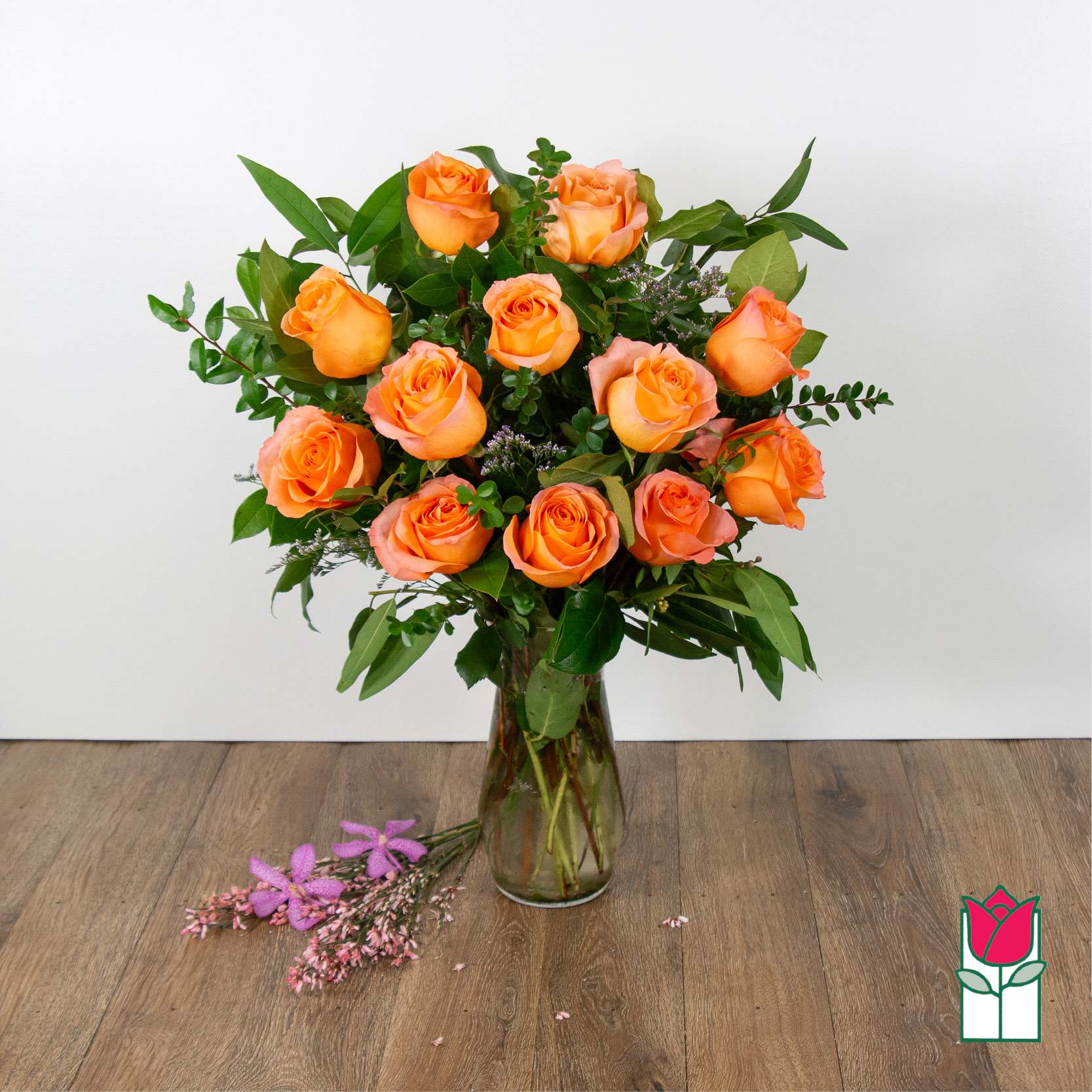 Beretania's Medium Stem Rose Arr - Peach Coral (Hues Vary) - Indulge in the timeless elegance of our Medium Stem Rose Arrangement, meticulously designed to captivate and inspire. Each exquisite arrangement is presented in a graceful glass vase, showcasing the natural beauty of our carefully selected roses. We take pride in sourcing the highest quality roses from around the world, ensuring that every bloom is a testament to luxury and sophistication.  Choose from a variety of captivating colors to personalize your arrangement, whether you prefer the classic allure of red, the soft romance of pink, or the purity of white. Our diverse range allows you to tailor this floral masterpiece to your unique style and preferences.  Convenience meets luxury with Beretania Florist. Enjoy the flexibility of ordering for pick-up or experience the ease of our convenient delivery service in the Honolulu area. Whether adorning your space or sending heartfelt sentiments to a loved one, our Medium Stem Rose Arrangement promises to elevate any occasion with its beauty and grace. Trust us to deliver not just flowers, but an exquisite floral experience that brightens your day.