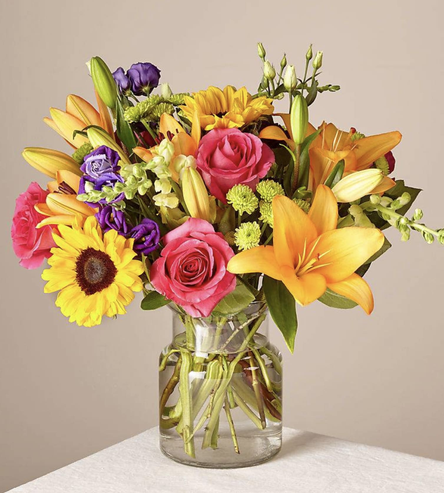 Best Day Bouquet - Make this day their best day. Our local florist handcraft a colorful array of flowers in a clear glass vase to create a celebration in bloom. Perfect to give for a special reason or to simply share a smile.