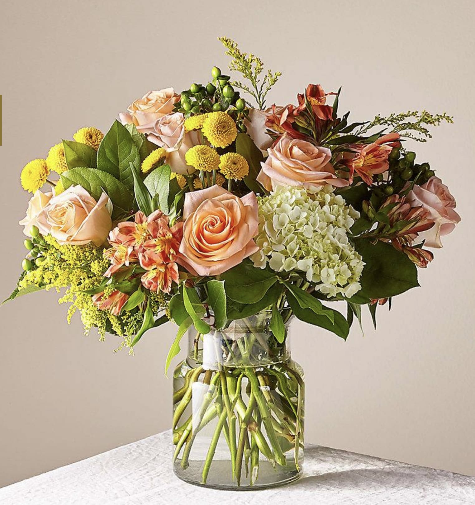 Life is a Peach Bouquet - This radiant bouquet is designed with a dreamy mix of peach, yellow, and light green blooms to create the perfect impression. Whether it's sent as a pick–me–up, a celebration, or just to make someone smile, everything is just peachy once this arrangement arrives.