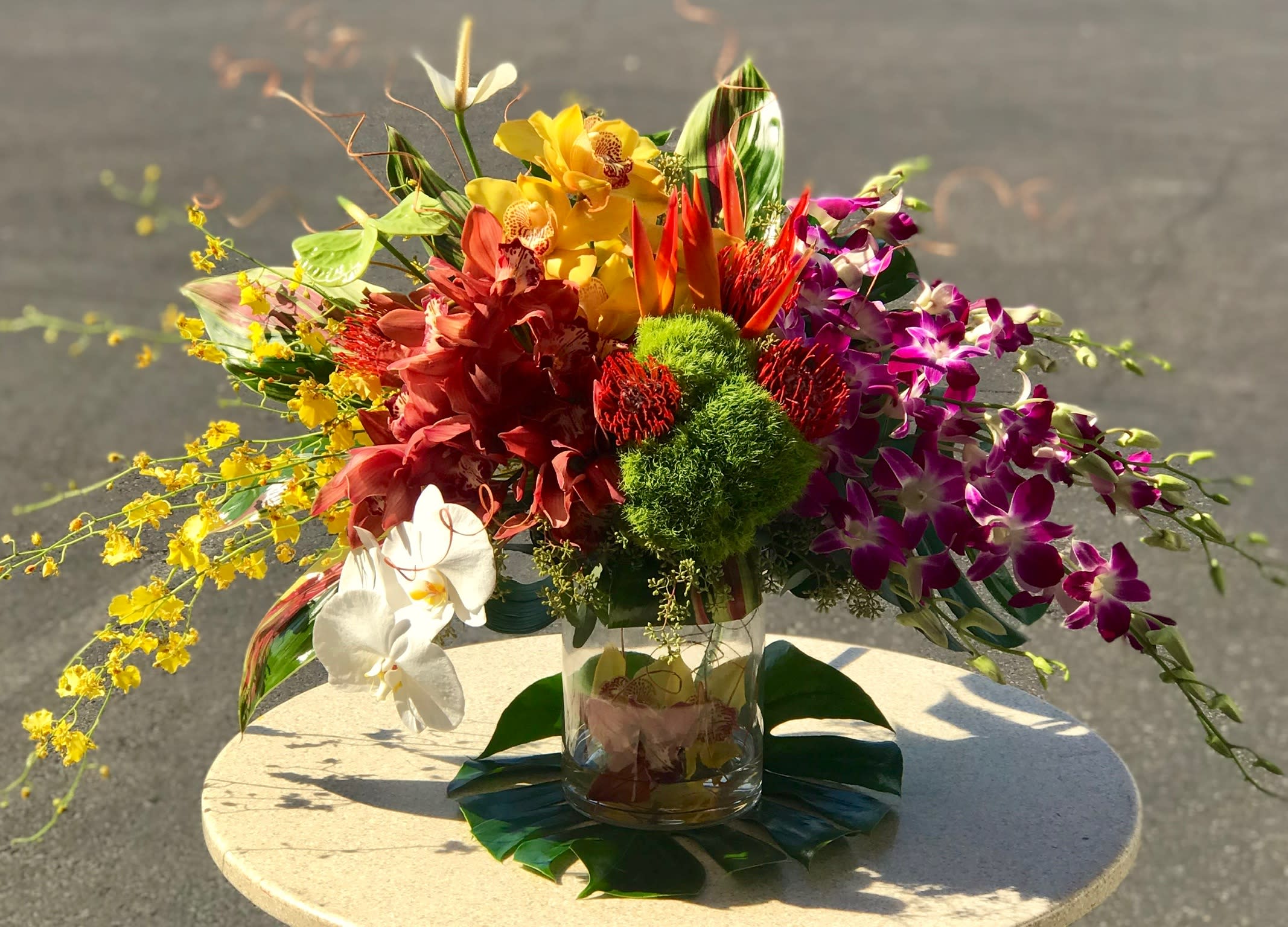 High Style Bouquet - The High Style Bouquet is on-trend and ready to wow your special recipient with it's mix of beautiful orchids. Dendrobium orchids, phalaenopsis orchids, cymbidium orchids and oncidium orchids.