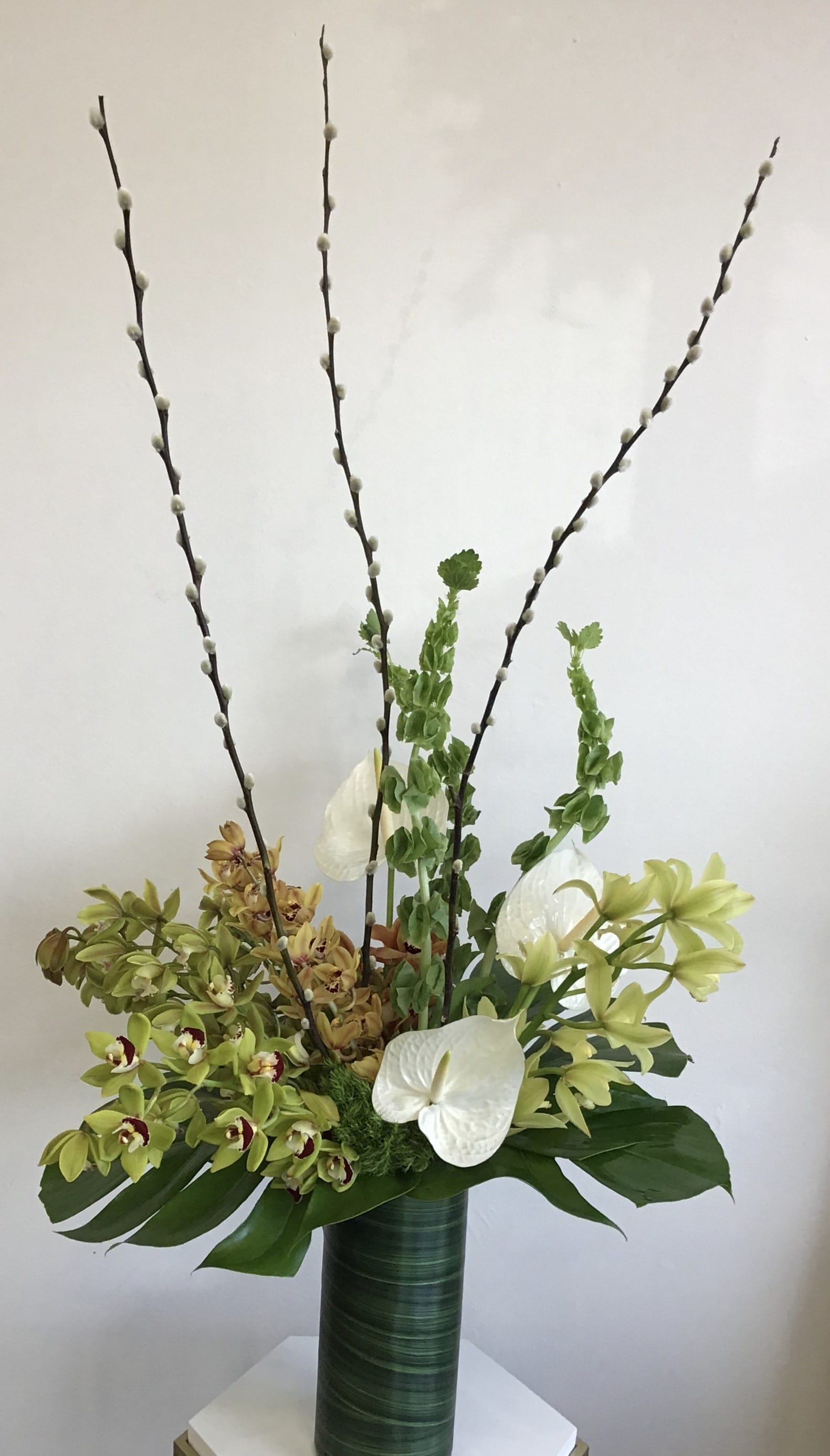 Tropical Statement Tropical Statement - Want to cause an impression or better yet make a statement this is the perfect piece, this tall, sleek design is perfect for anyone trying to cause a good impression. Designer will put together a beautiful tall tropical arrangement, in a premium vase. Please specify any color and/or specific floral that may be of your choice, designer will do their best to accommodate.