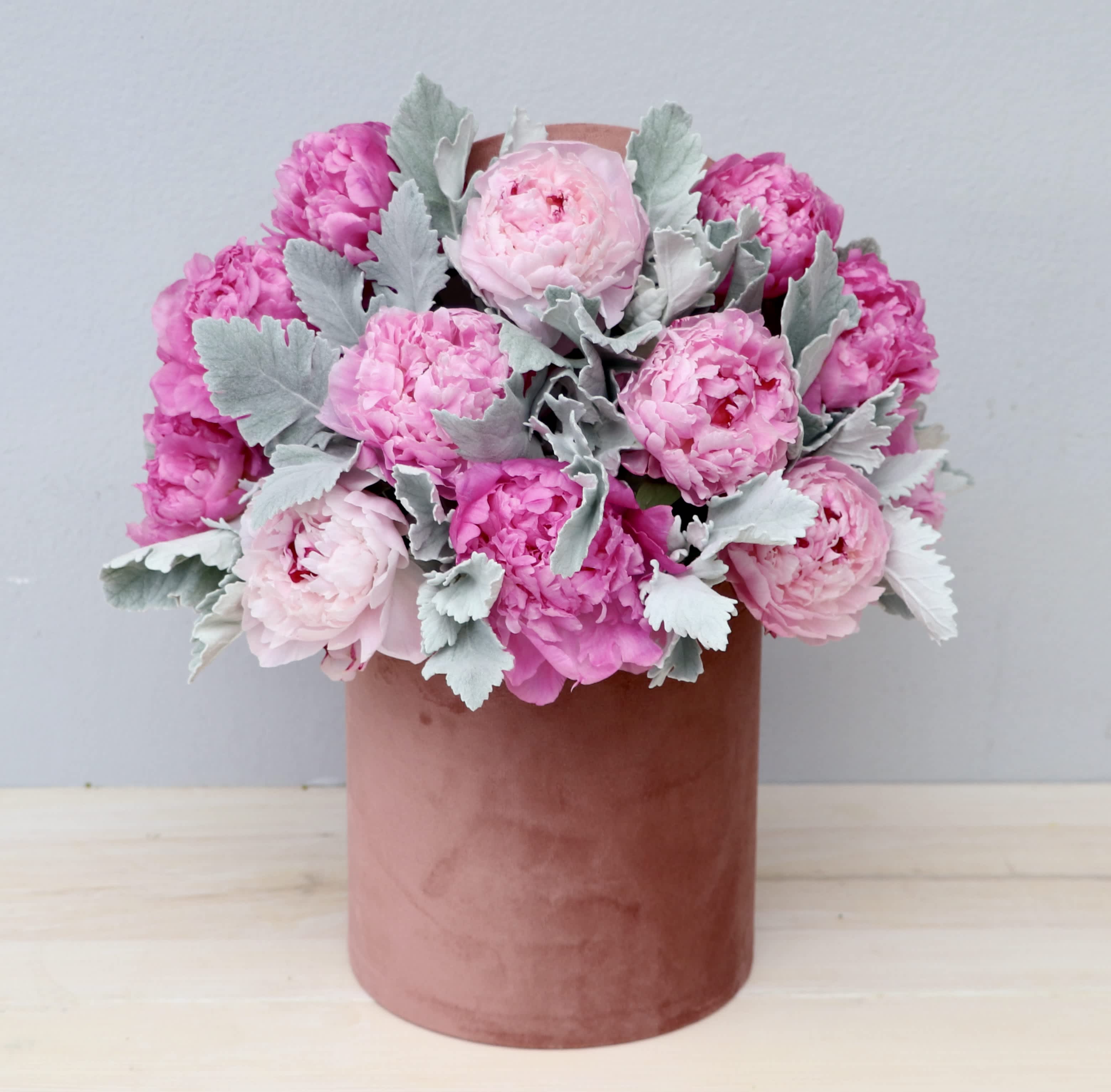 Peony Hat Box - My Glendale Florist - A pink hatbox overflowing with peonies! Peonies are one of our favorites; filled with fragrance and grace. The standard size includes about 12 peonies and increases with each upgrade. 