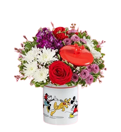 Disney Mickey Mouse &amp; Friends Cookie Jar - Romance (SALE $10 OFF!!) - EXCLUSIVE Share the love this Valentine’s Day with a gift full of character(s)! Part of our exclusive Disney collection, this handcrafted bouquet is gathered in radiant colors and designed in our whimsical Mickey Mouse and Friends cookie jar, featuring iconic animations of the whole gang. Great as a keepsake container or to keep delicious treats, it’s a sweet and nostalgic surprise for someone special.