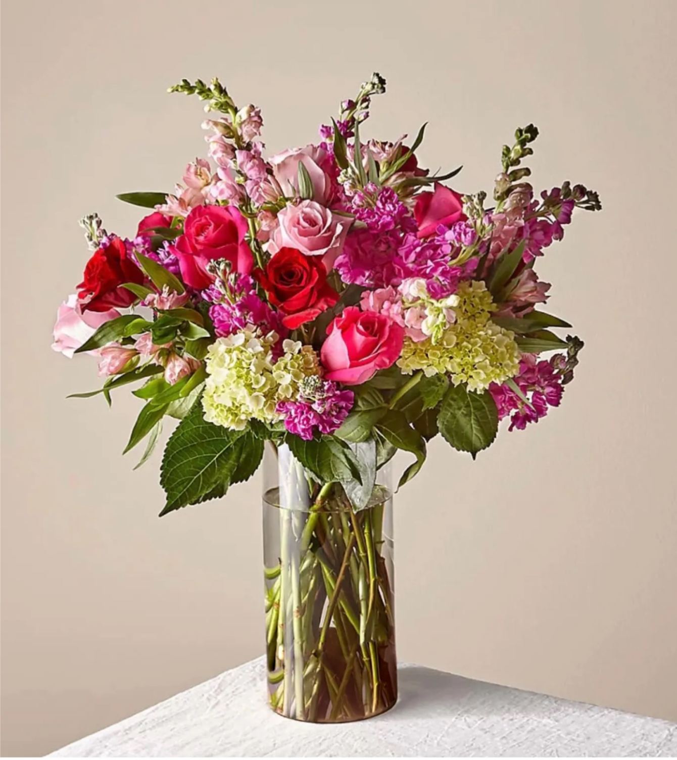 You &amp; Me Luxury Bouquet - It's the season of love, and this bouquet is the bold, romantic gesture you're looking for. Three colors of roses (red, pink &amp; hot pink) mixed with hydrangea, snapdragons &amp; more flowers in a glass vase is the perfect way to remind your love that you were meant to be together.