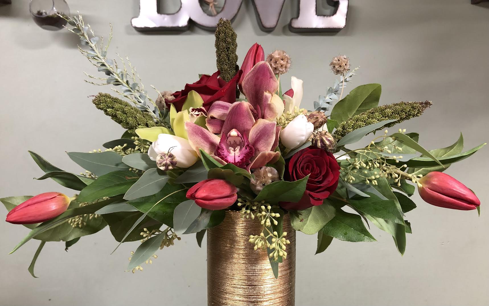 Warm Winter - Tulips, Roses Scabiosa, Orchids etc. in vase.