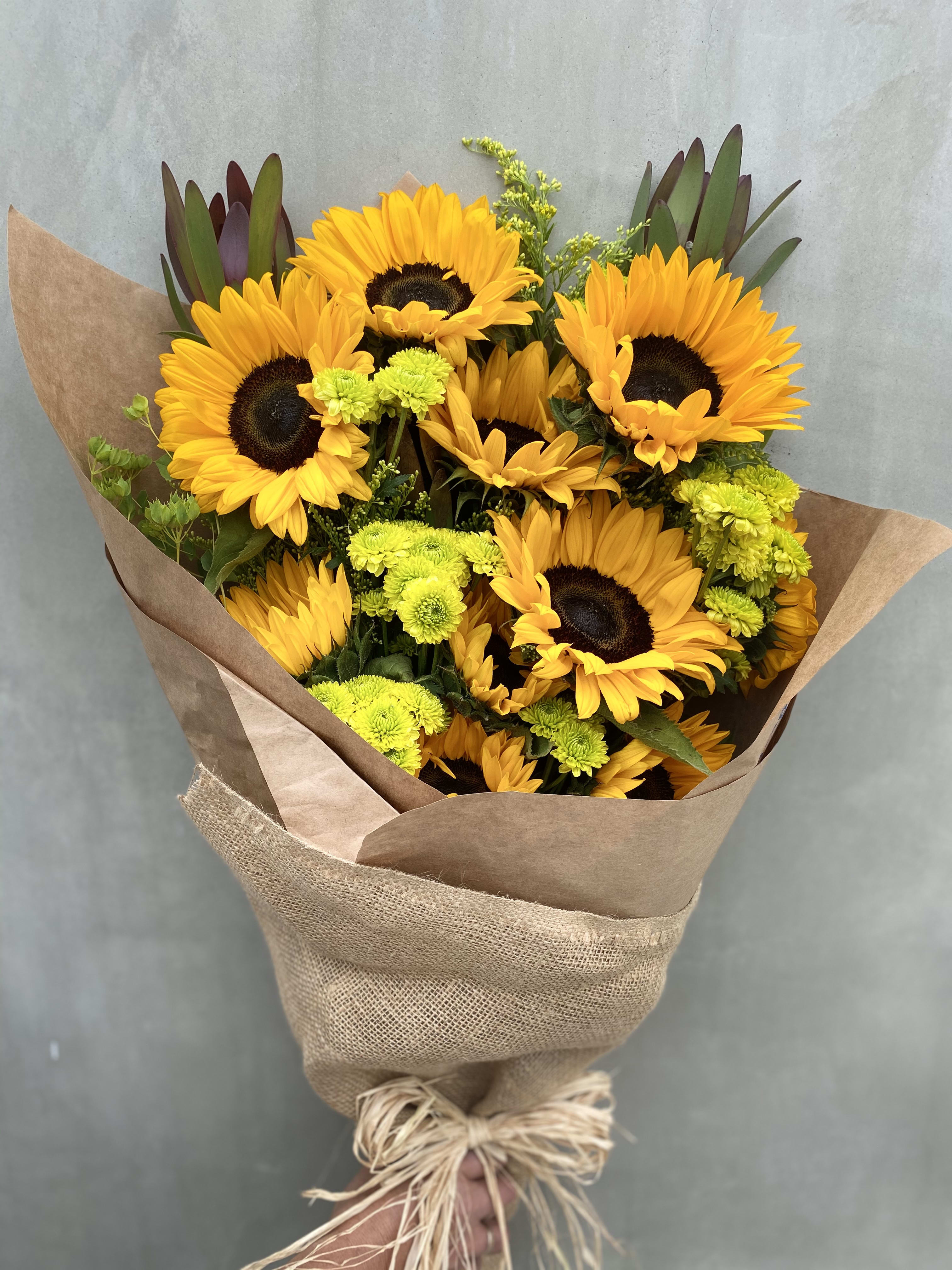 Smiling Day Smiling Day - Beautiful sunflower with green pompoms just what you need to make everyones smile.