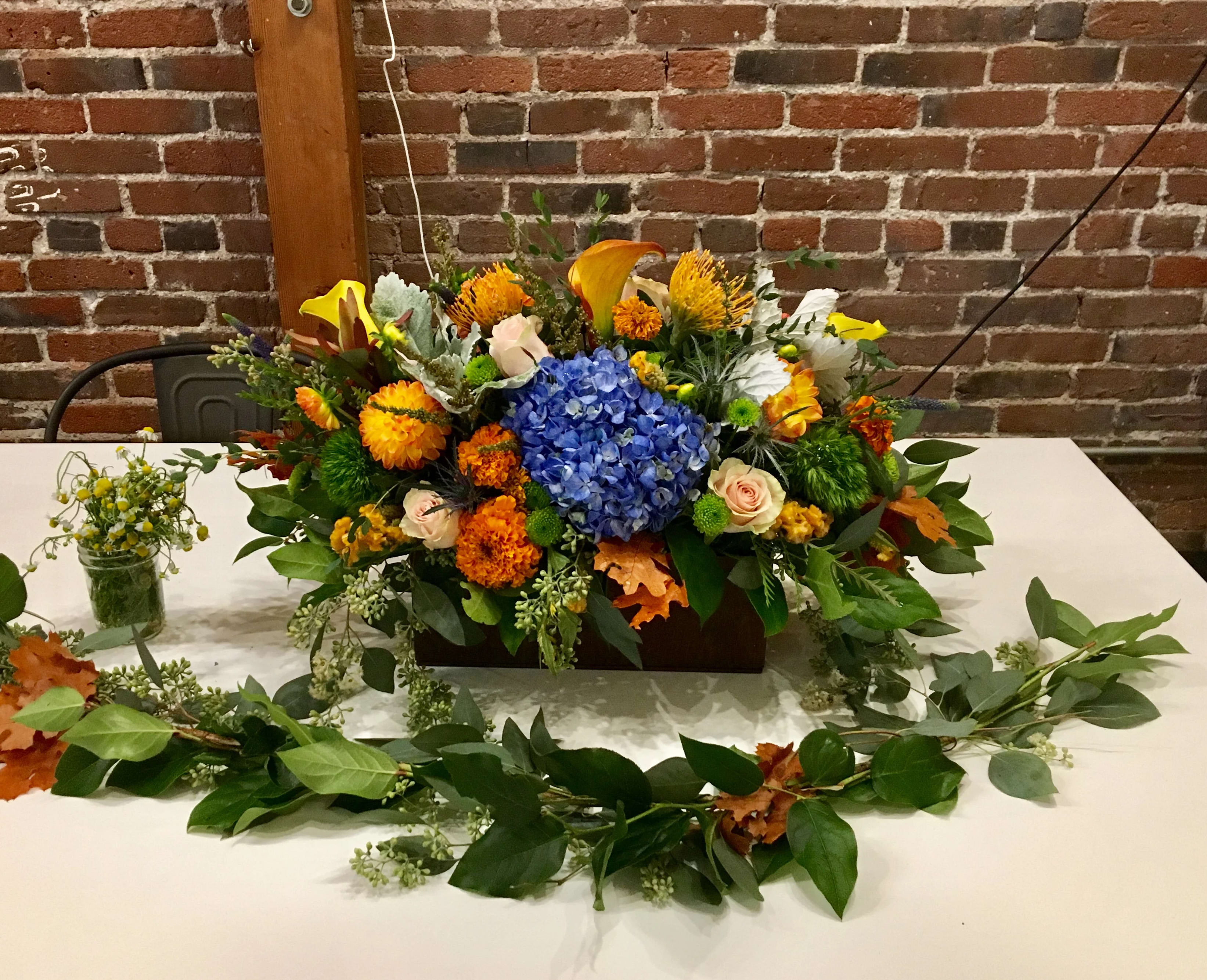 Woodsy Essence  - A perfect Center piece for a family and friends get together,  Calla lilies, hydrangeas, and much more. 