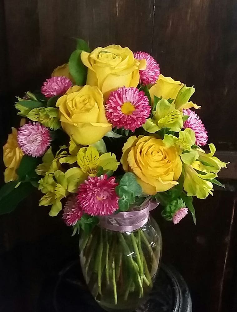 Yellow & Pink Yellow & Pink - Petite arrangement filled with yellow flowers, roses, alstroemerias, and pink Matsumoto.