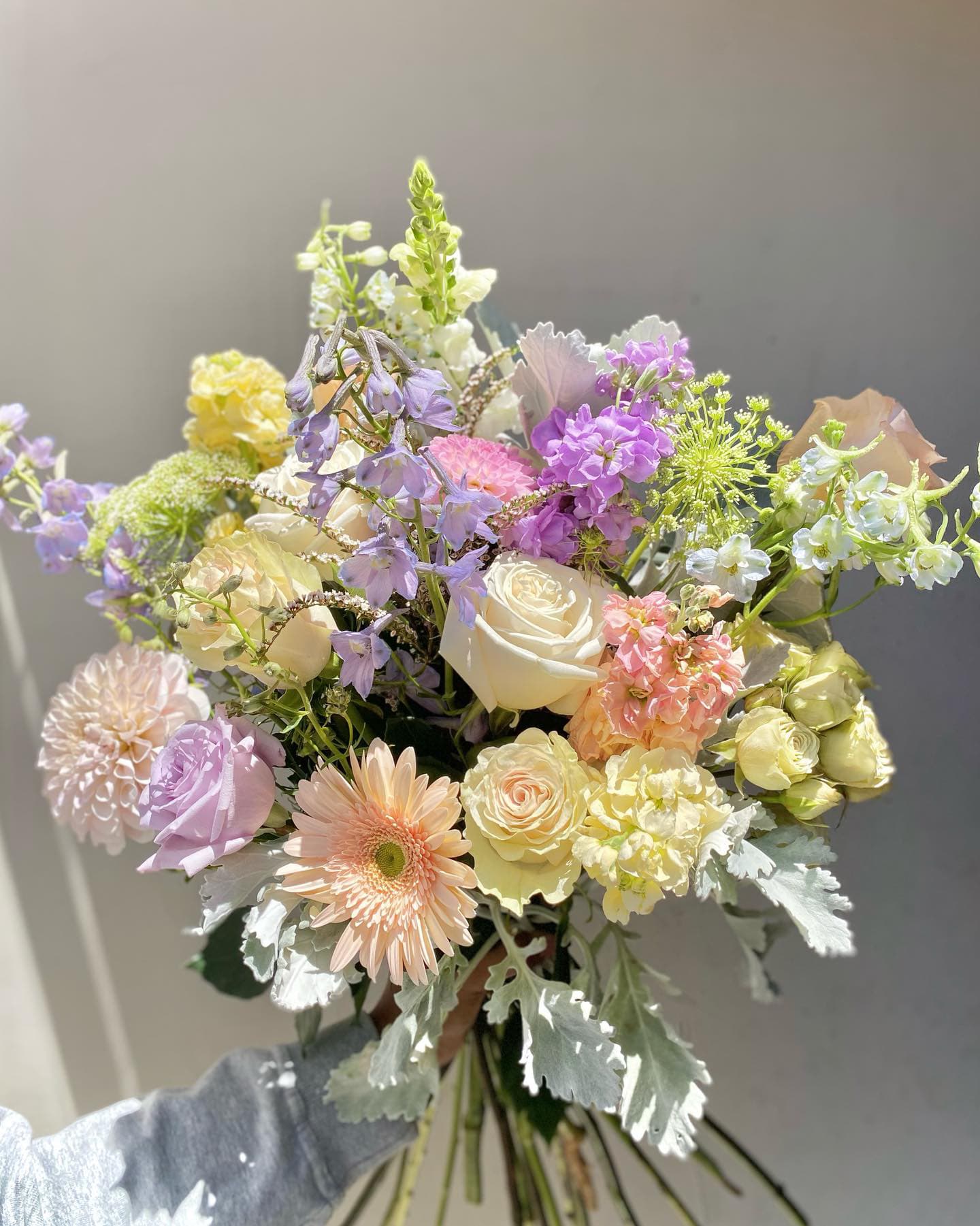 Pastel Dreams Pastel Dreams - This soft palette bouquet wrapped in brown paper includes a mix of seasonal blooms that will make you fall in love. Note: Seasonal Flowers will be used to replace those not in season. Like dahlias, for example. Regardless, we will stun you.