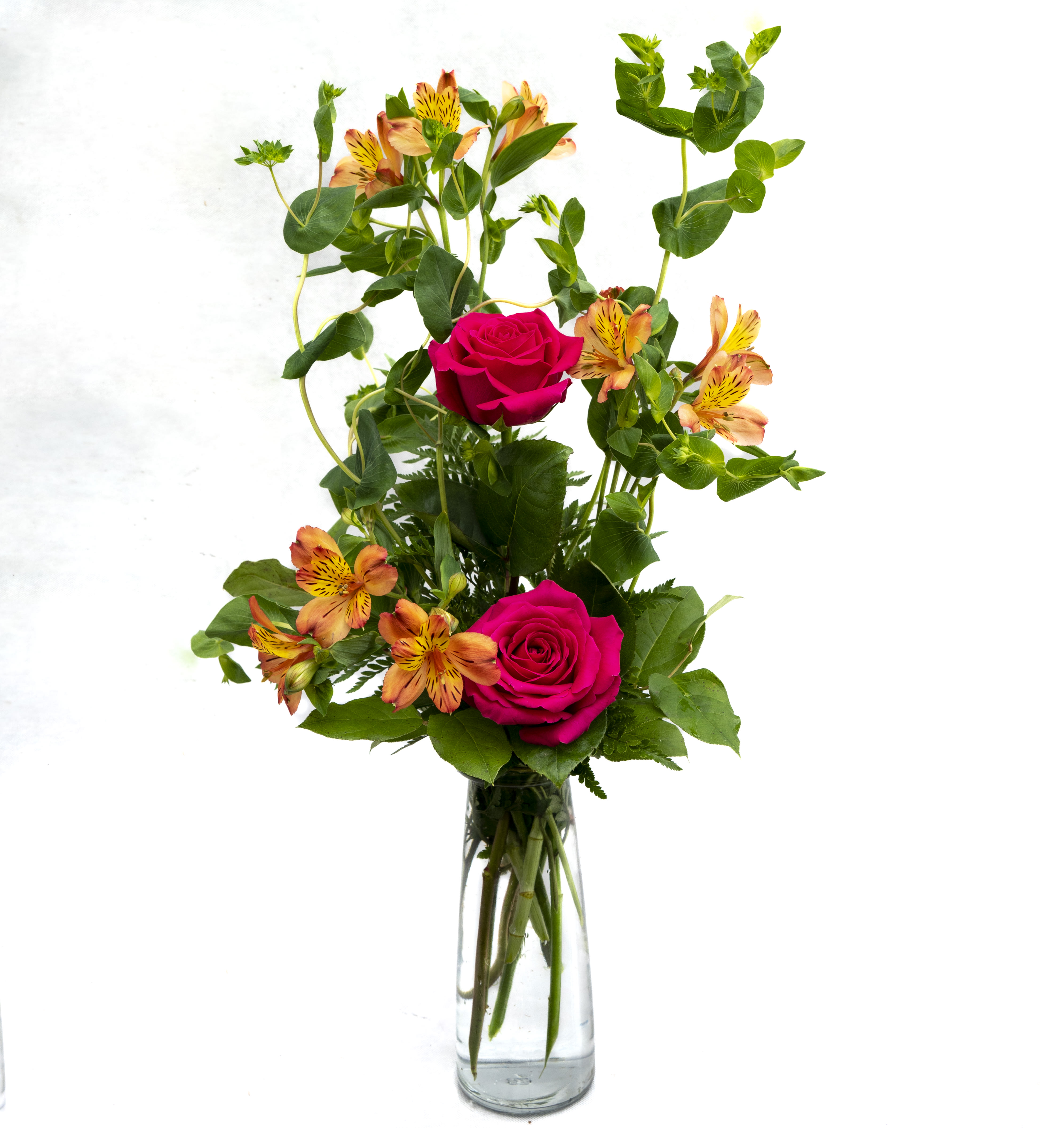 Celebrate Something - Beautiful vase that includes Bluplureum, orange Alstroemeria, hot pink Roses and greenery.
