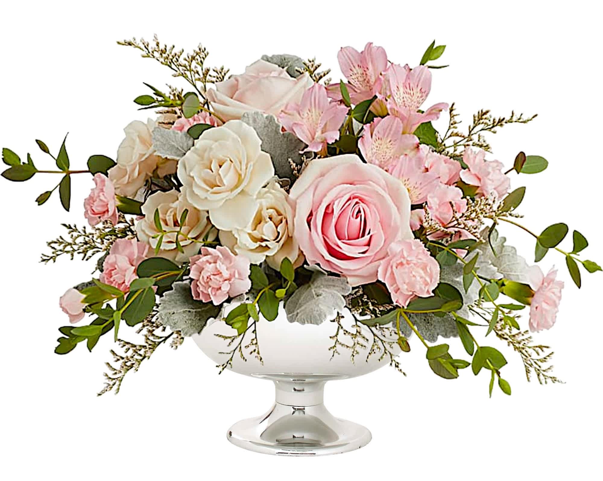 Rosy Skies - Illuminate love with embracing soft pastel shimmer and cradling an exquisite arrangement of vibrant pink flowers, a timeless expression of artistic beauty for any occasion.  DETAILS Embrace enchantment with the Rosy Skies arrangement, a delicate arrangement of light pink roses, crème spray roses, light pink alstroemeria, miniature pink carnations, and parvifolia eucalyptus, all in a silver cup which makes a radiant gift for any celebration.  FLORIST-TO-DOOR  Orientation: All-Around  BLOOM DETAILS Roses Spray Roses Mini-Carnations Alstroemerias Limonium Greenery  The Standard Arrangement is approximately 11&quot; H x 16&quot; W. The Deluxe Arrangement is approximately 11 1/2&quot; H x 17&quot; W. The Premium Arrangement is approximately 12 1/4&quot; H x 17&quot; W.  Designed by our award-winning florist designers.  HOW TO CARE FOR YOUR FLOWERS 1. Keep in a location without direct sunlight and away from extreme heat or cold. 2. Add water regularly to keep floral foam moist and mix in the flower food packet provided. 3. Trim the stems at an angle every other day. 4. As flowers/foliage wilt, remove &amp; discard  Please Note: The arrangement pictured reflects an original design for this product. While we always do our best to follow the original flower recipe, the exact flower or container is sometimes unavailable. We may replace items of equal or greater value to deliver the freshest flowers possible while keeping the style &amp; color palette. We assure you that we will create a beautiful, fresh flower arrangement with only the best quality flowers to keep you as a loyal customer.  How to place an order? We have several options. 1. You can place an order directly on this secure website... OR 2. You can call in your order by dialing: (323) 262 - 9238... OR 3. You can visit our store (appointment recommended 323.262.9238)  NINFA'S FLOWERS 2405 WHITTIER BLVD. LOS ANGELES, CA. 90023  ATTENTION: *Please note that on busy holidays, Valentine's Day, and Mother's Day, we cannot verify if the recipient received the flowers until the following day because our drivers don't turn in their signature delivery tablets until the following day. You can verify delivery on the website after 10:00 pm, call 323.262.9238 the following day after 10:00 am, or contact the recipient directly if you haven't received a call from them. Thank you for your patience and understanding.