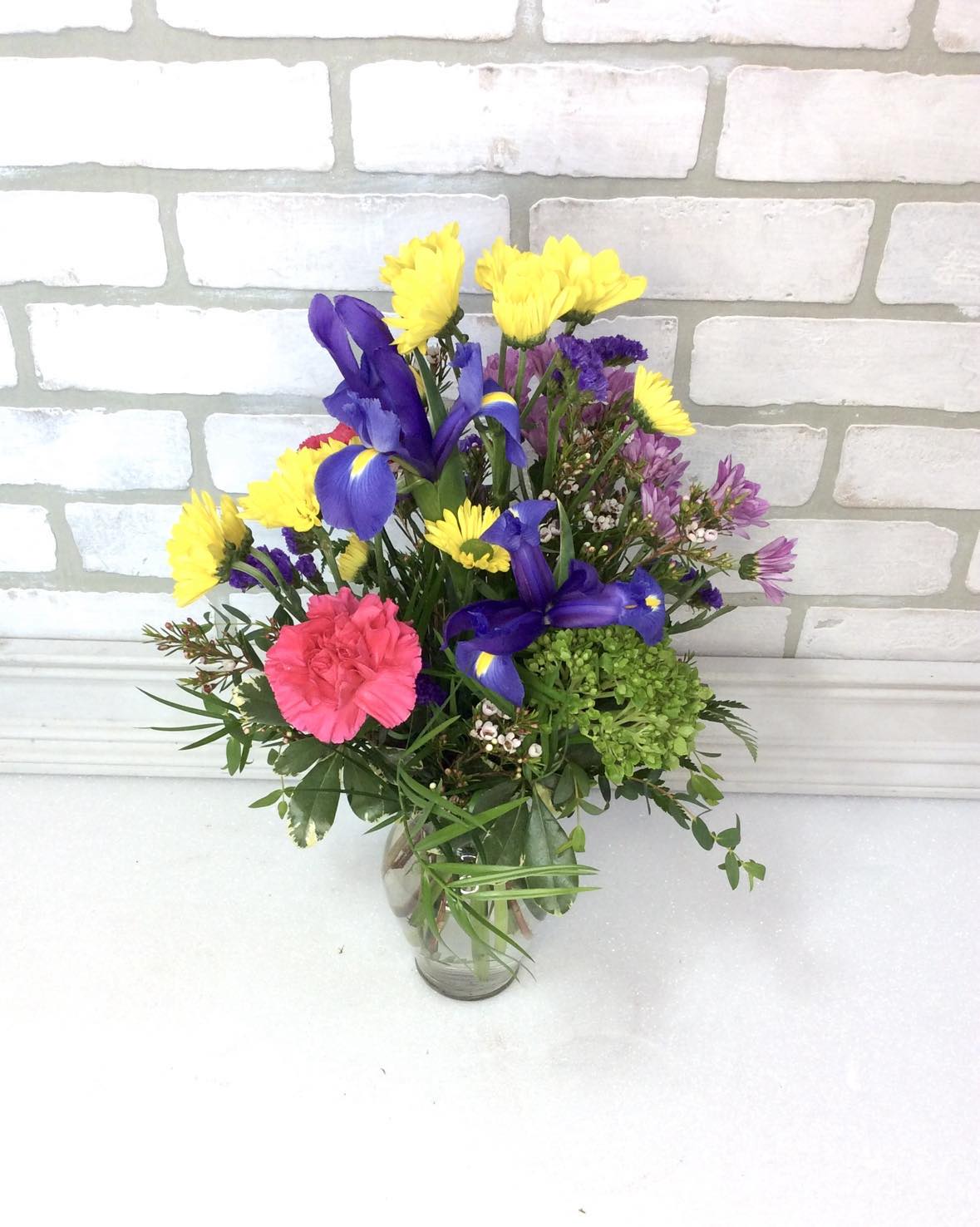 Spring has Sprung - The true essence of spring is in the palette of colors it brings to life and this arrangement has all the colors to brighten up their day. 