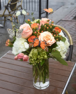 Monarch Meadow - Featuring butterflies, premium roses, ranunculus, tulips and hydrangea this arrangement is great for spring! Send to a friend, co-worker or loved one; Monarch Meadows will be sure to make them smile.