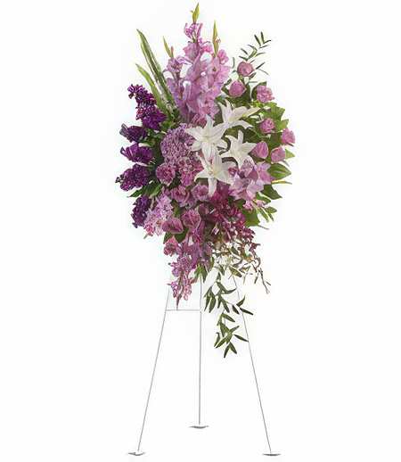 Lavender Elegance - Rich, regal, and utterly radiant, this magnificent display pays a most wonderful tribute overflowing with luscious flowers, breathtaking beauty, and loving remembrance.  Easel not included.