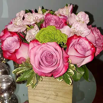 lilac in bloom - Lavender roses in a beautiful wooden box arrangement adorned with colorful sprays of green and white.  Perfect for mom.