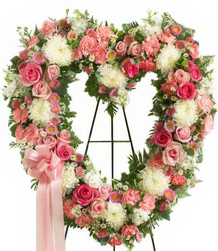 Remember for Life Sympathy - Always Remember for Life of a loved passed on for life long warmest memories are a true gift. An open heart standing wreath dazzled in precious pink and white blossoms shimmer with beauty and charm. Shower that grieving loved one with an underlying love that heals the soul.  Easel not included.
