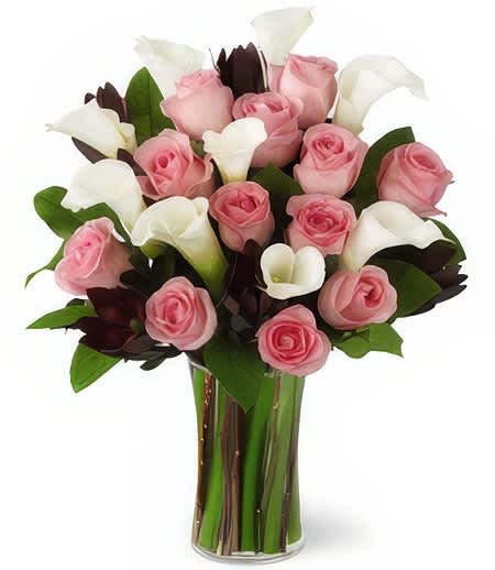 Gentle Embrace - Whispers those Gentle Embraces in that special someone's ear and wish upon a star in the land of unconditional love. Gentle pastels in the perfect hues of creamy white and precious pink highlight that delicate moment in a time of grief and healing.  Number of flowers may vary depending on their size  Add water daily to ensure your floral arrangement stays fresh and display the flowers in a cool location away from direct sunlight.