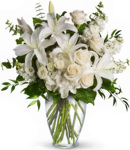 Dreams from the Heavens - Exemplify the heights of glory with this bountiful bouquet! Overflowing with fresh flowers in a dazzling display, this wonderful gift truly speaks straight from the soul.  Add water daily to ensure your floral arrangement stays fresh and display the flowers in a cool location away from direct sunlight.