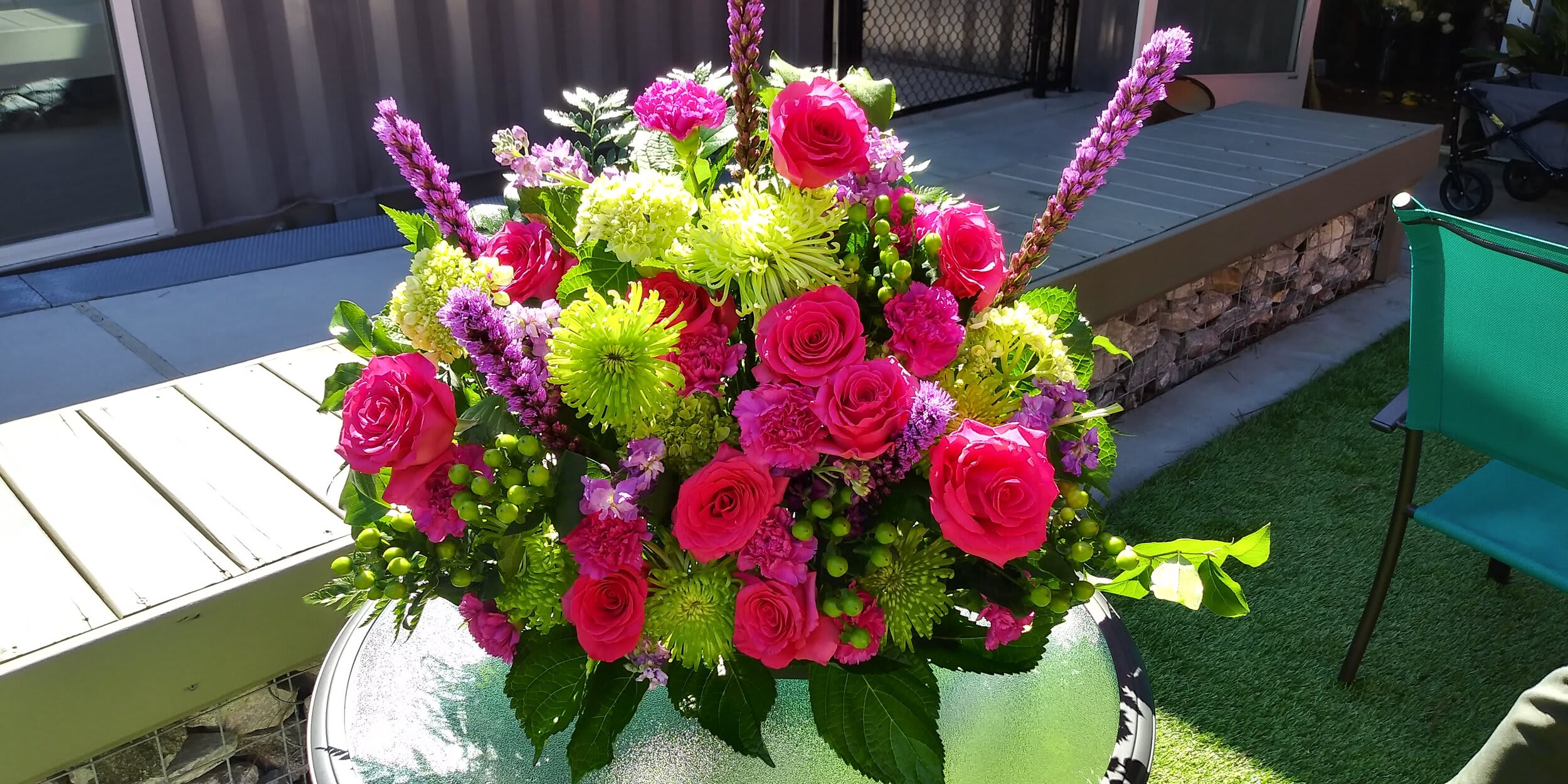 Royal Grace Basket - A full basket of green Chrysanthemums, Hot Pink Roses,  pink carnations, green Hypericum, purple Liatrice with Salal with other assorted greenery.
