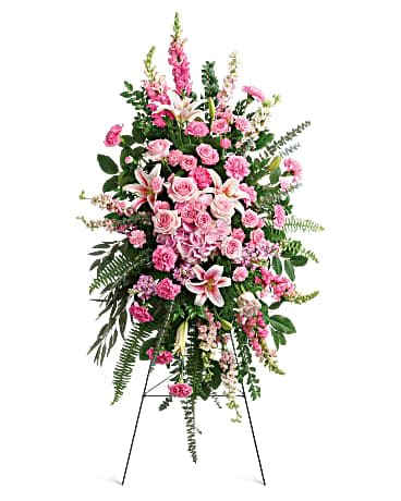 Glorious Farewell Spray - This glorious spray of pink hydrangea, roses and lilies is an especially fond, feminine farewell to one deeply loved. This glorious spray includes pink hydrangea, light pink roses, light pink spray roses, pink oriental lilies, pink carnations, miniature light pink carnations, pink larkspur, pink snapdragons, pink stock, huckleberry, sword fern, asparagus plumosus and greenery. Delivered on a wire easel.