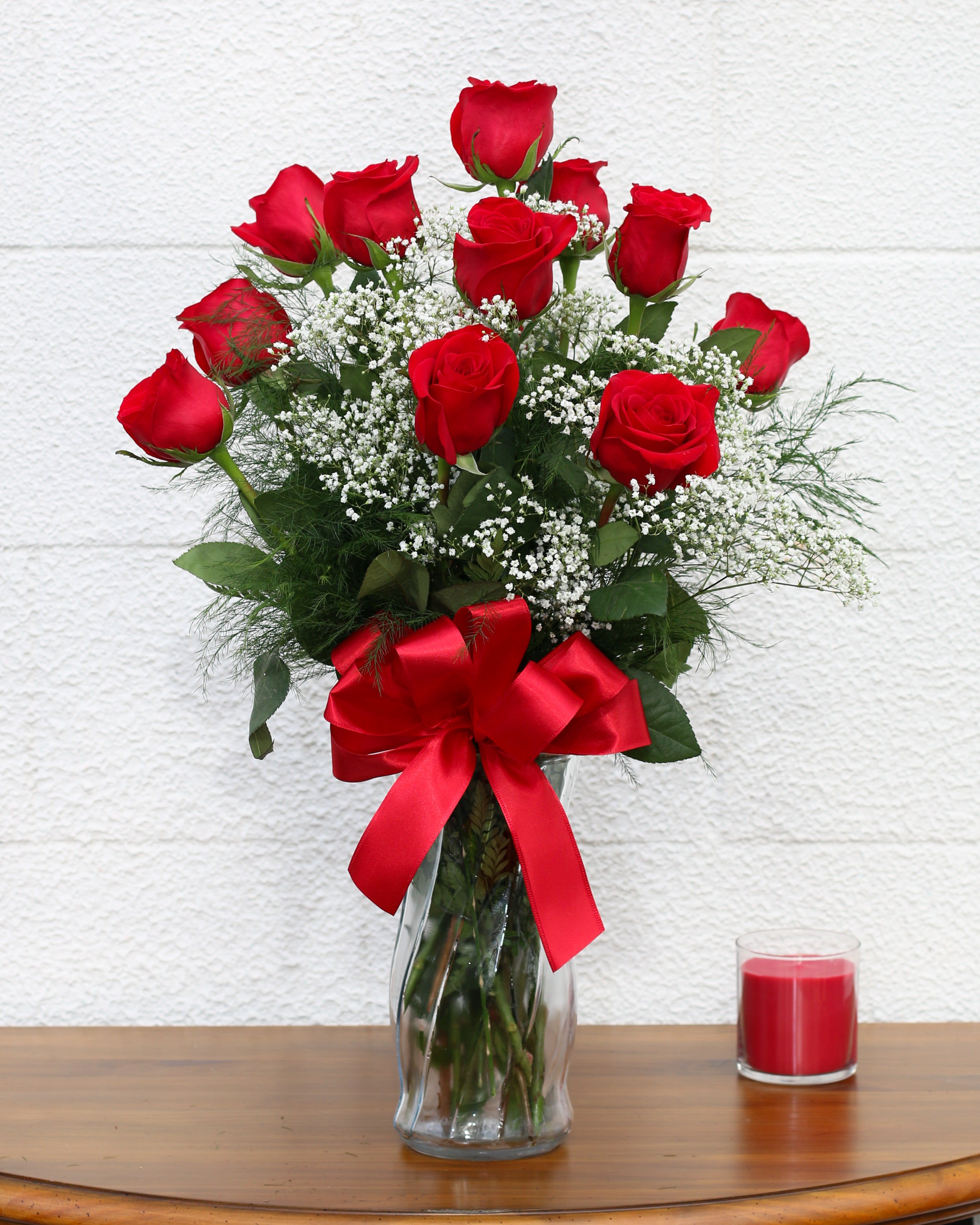 Dozen Red Roses Dozen Red Roses - A classic dozen red roses in a vase with greenery and baby's breath.