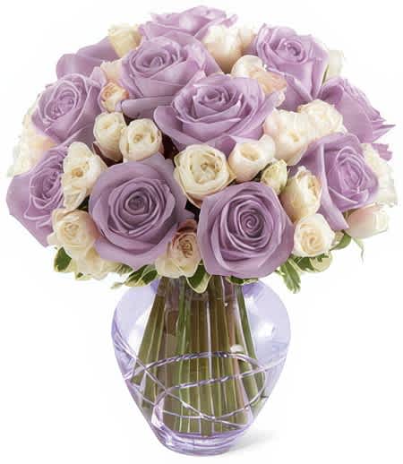 English Lavender - Fresh flowers in hues of luxurious lavender and pristine white sparkle with beauty and grace from this exquisite bouquet! Breathtaking appeal and sweet floral scents make these blooms a truly perfect gesture of your deepest sympathy and support.  Clear vase may be used if color is not available.  Add water daily to ensure your floral arrangement stays fresh and display the flowers in a cool location away from direct sunlight.