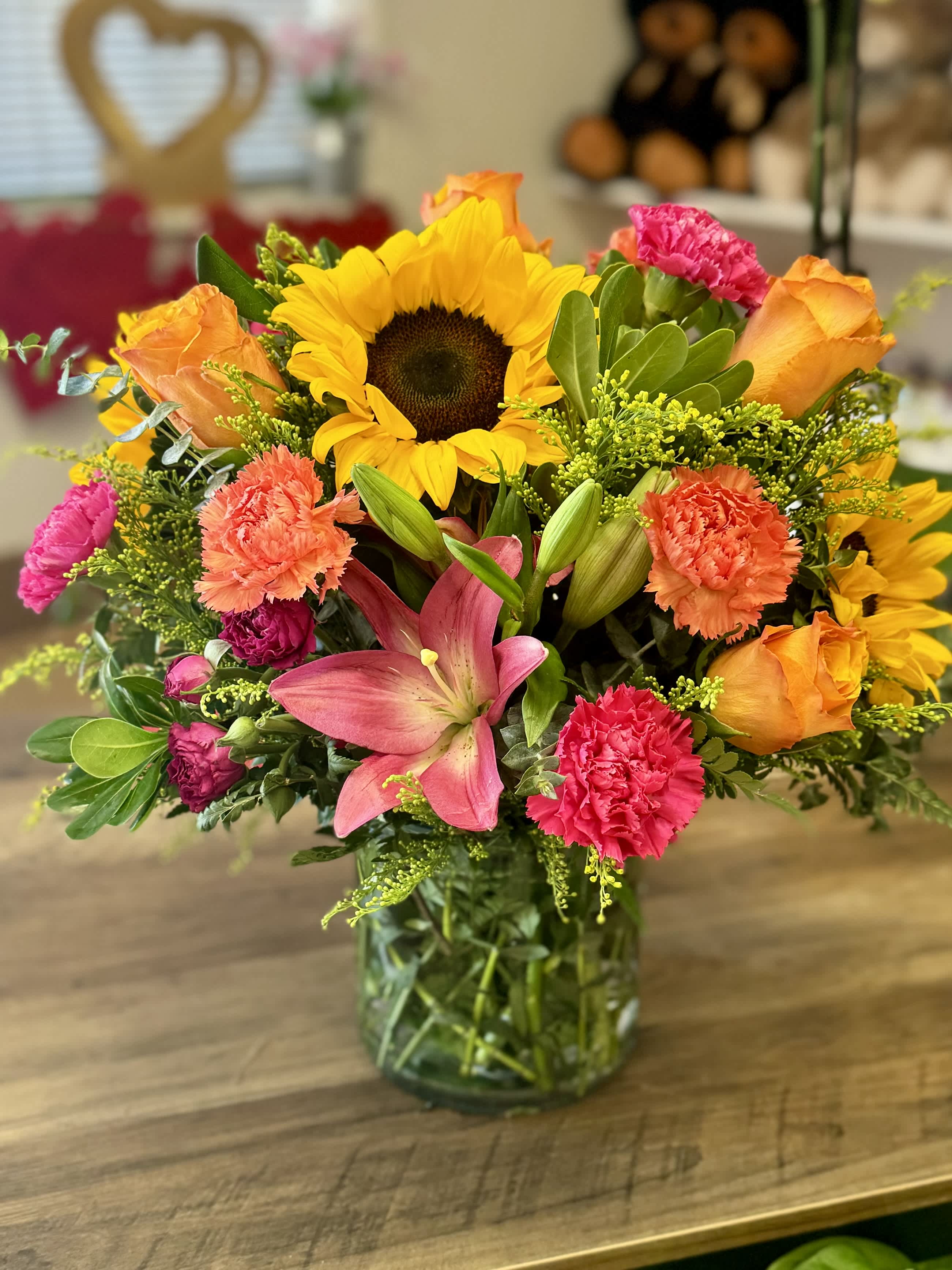 Because of You - A beautiful colorful array of bright florals that will overwhelm that special love one! Especially on Mother’s Day! 