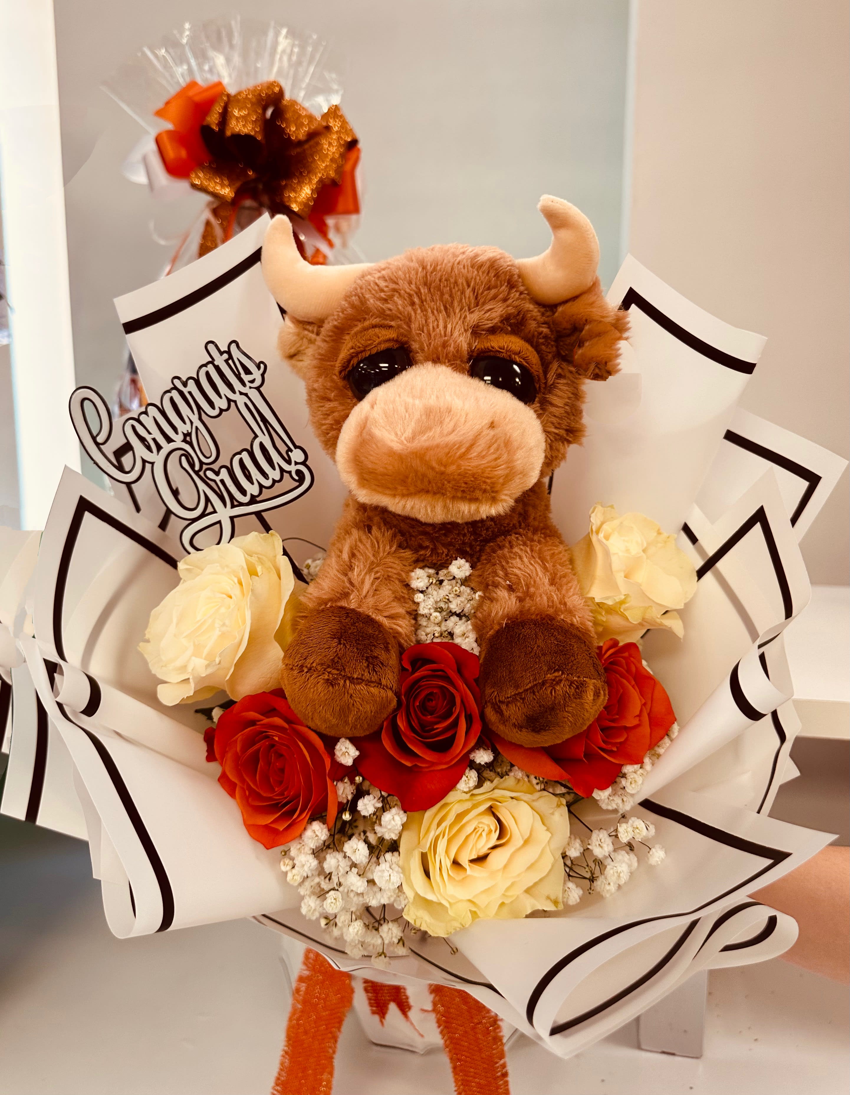 Half Dozen Bouquet with Longhorn - Half Dozen Roses in a bouquet in United Colors with a Longhorn plush.