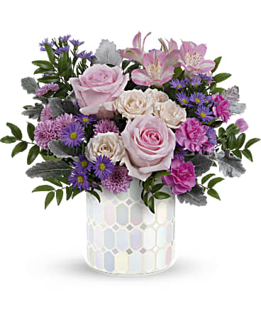  Alluring Mosaic Bouquet - Add a touch of elegance to any space with Teleflora's Alluring Mosaic cylinder, a timeless piece that sparkles with pastel shimmer, perfectly complementing a lush bouquet of pink and purple flowers, making it a cherished centerpiece for years to come.. Indulge in soft, pastel shimmer with Teleflora's Alluring Mosaic cylinder, perfectly complemented by a bouquet of pink roses, crème spray roses, pink alstroemeria, hot pink miniature carnations, lavender button spray chrysanthemums, and huckleberry for an enchanting Mother's Day gift. Orientation: All-Around
