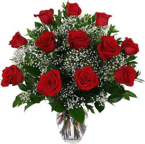 One Dozen Roses - One dozen red roses arranged with lush greenery and a filler of our choice in a 10&quot; urn vase. Are you looking for a grand look? Give us a call at (530)406-1711 and we can upgrade to 24, 36 or even 100 roses! 