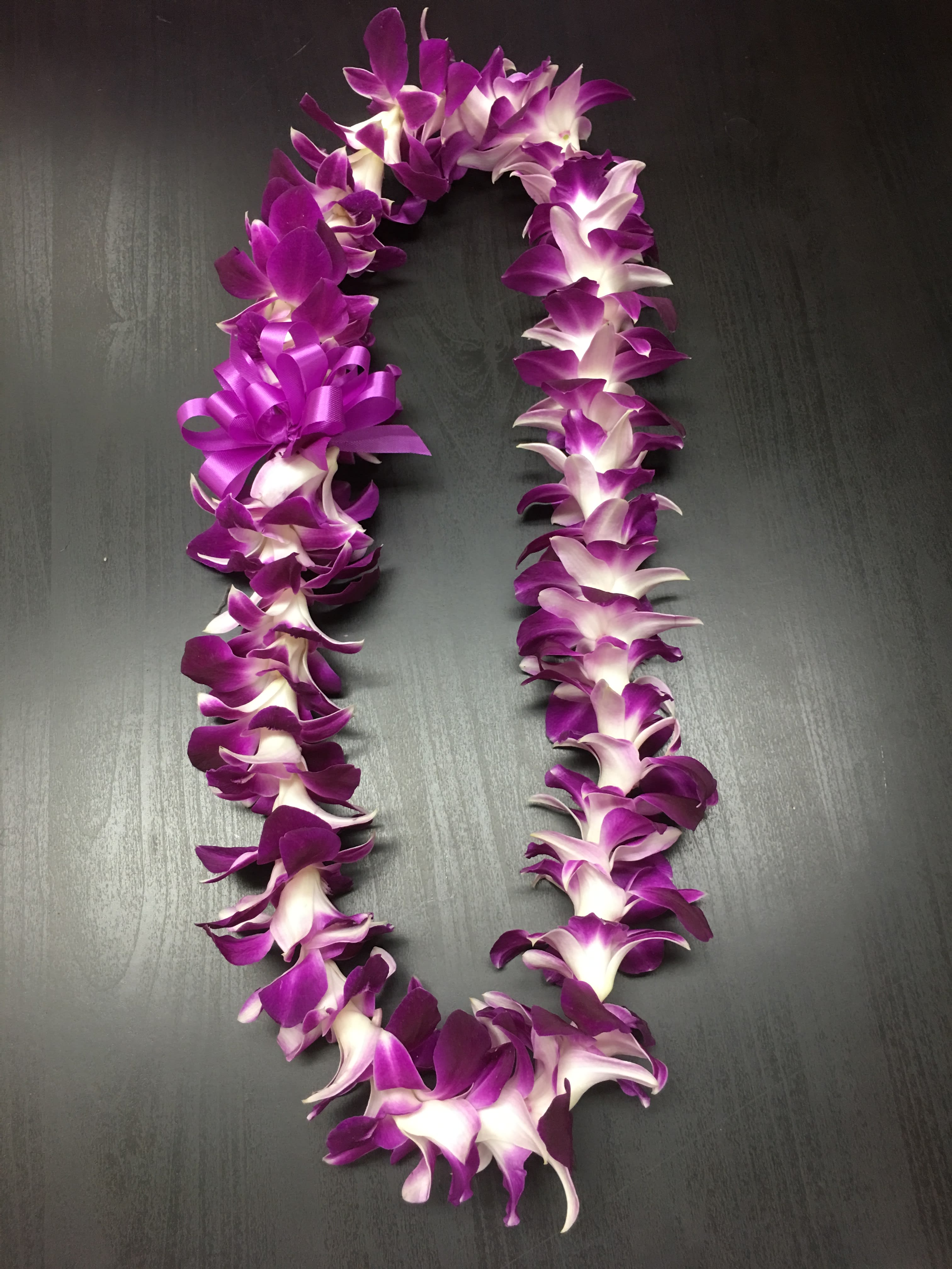 Purple Single Orchid Lei - The purple orchid is the most popular lei flower and also the strongest of the orchid colors. 