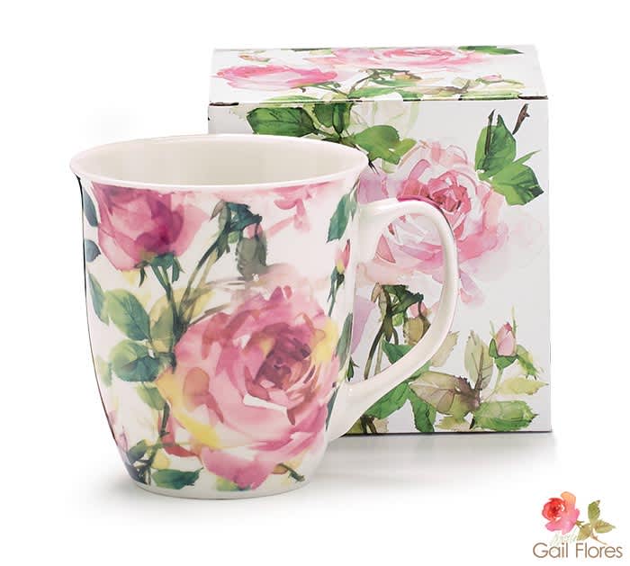 Pink Roses Mug - Dishwasher safe/FDA approved/Microwave safe. White porcelain mug with large pink rose blooms and green leaves all around. Interior and handle are white.  4.75&quot;H x 6&quot;W x 4&quot;D. Capacity: 16 oz.