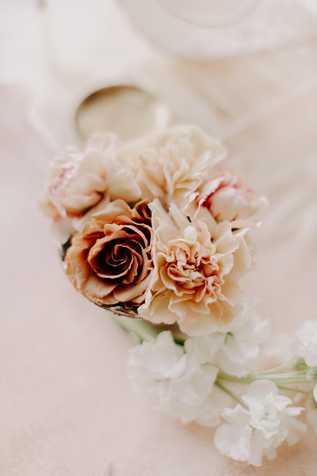 Wrist Corsage - Our corsage designs are very natural with unexpected elements to add interest.  We use flower varieties that hold up well.