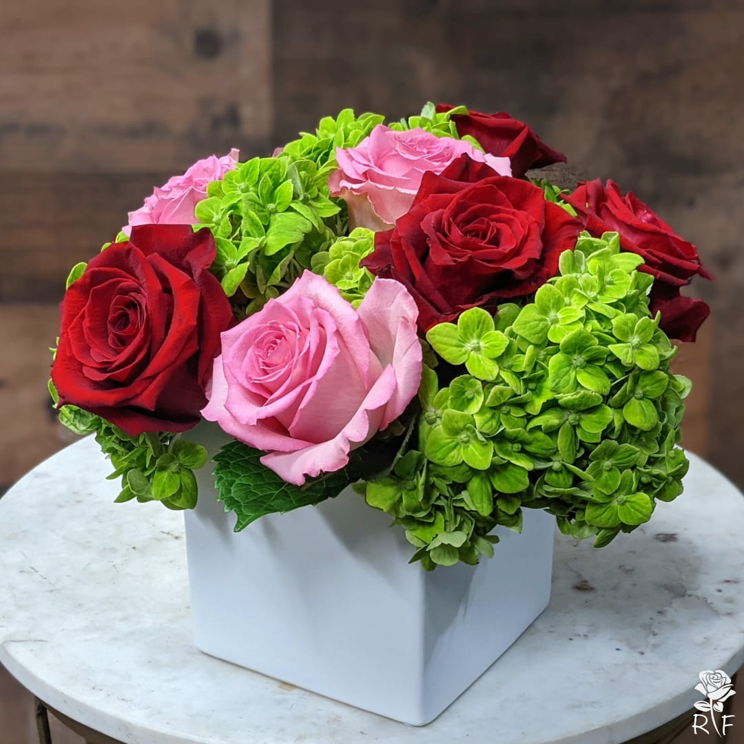 Young Love  - This arrangement includes blush pink roses, red roses, blush spray roses, white hydrangea. Young Love is the perfect gift to wish someone a happy birthday or to say thank you.   APPROXIMATE DIMENSIONS:10&quot; H X 11&quot; W X 11&quot;L