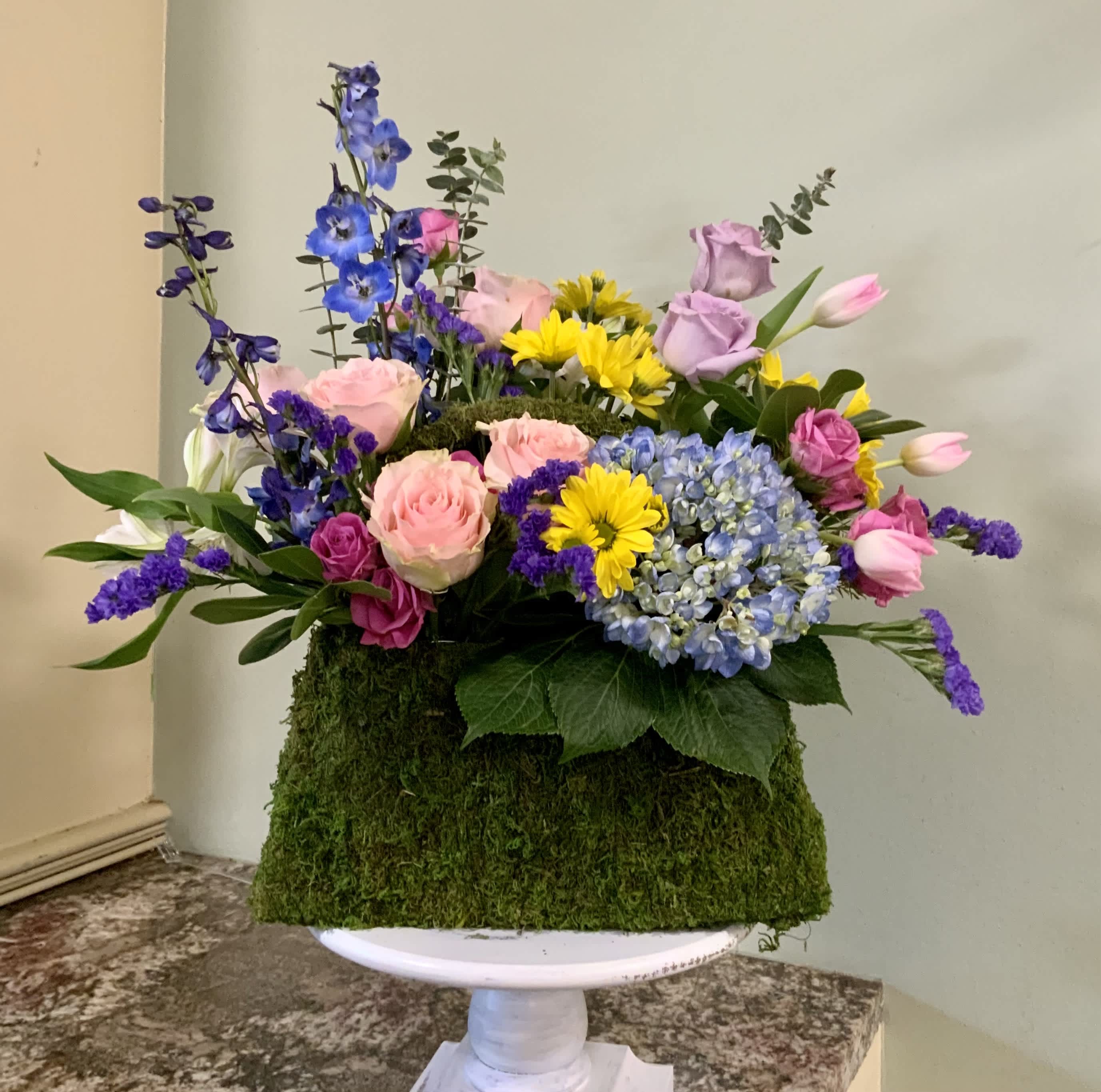 The Perfect Purse The Perfect Purse - The Perfect Purse from Legacy showcases her favorite flowers in a custom mossy green purse container. The Perfect Present for Mom, birthdays, just because. Shown here with geraniums, hydrangea, ferns and other florals. We can create the perfect combination using your specified flowers.